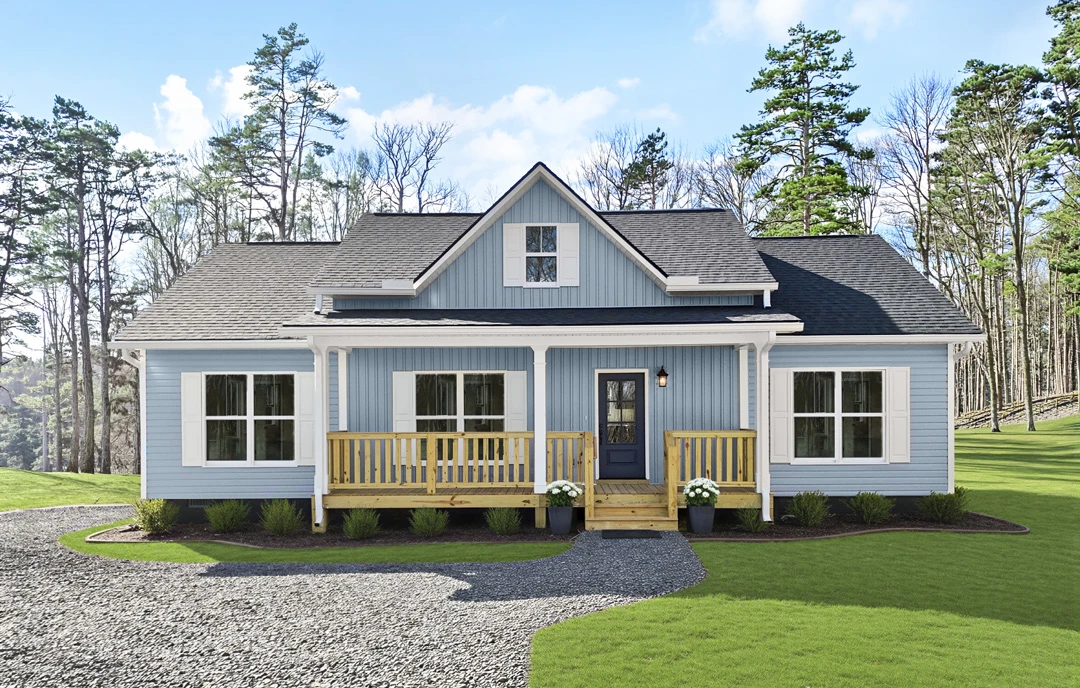 White farmhouse-style home with a covered porch, white railing, glass-paneled front door, and a driveway bordered by grass and trees.