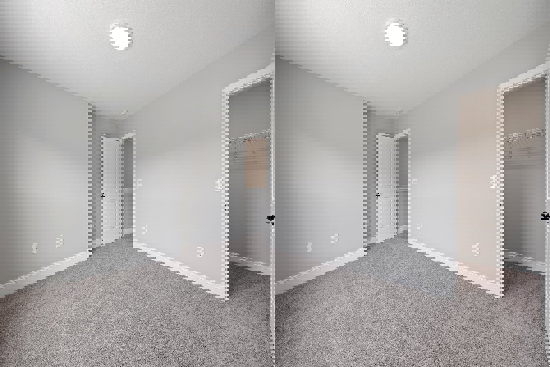 Carpeted bedroom with open white door featuring black knobs, white ceiling with round light fixture, closet with white walls and black door, white baseboards and molding