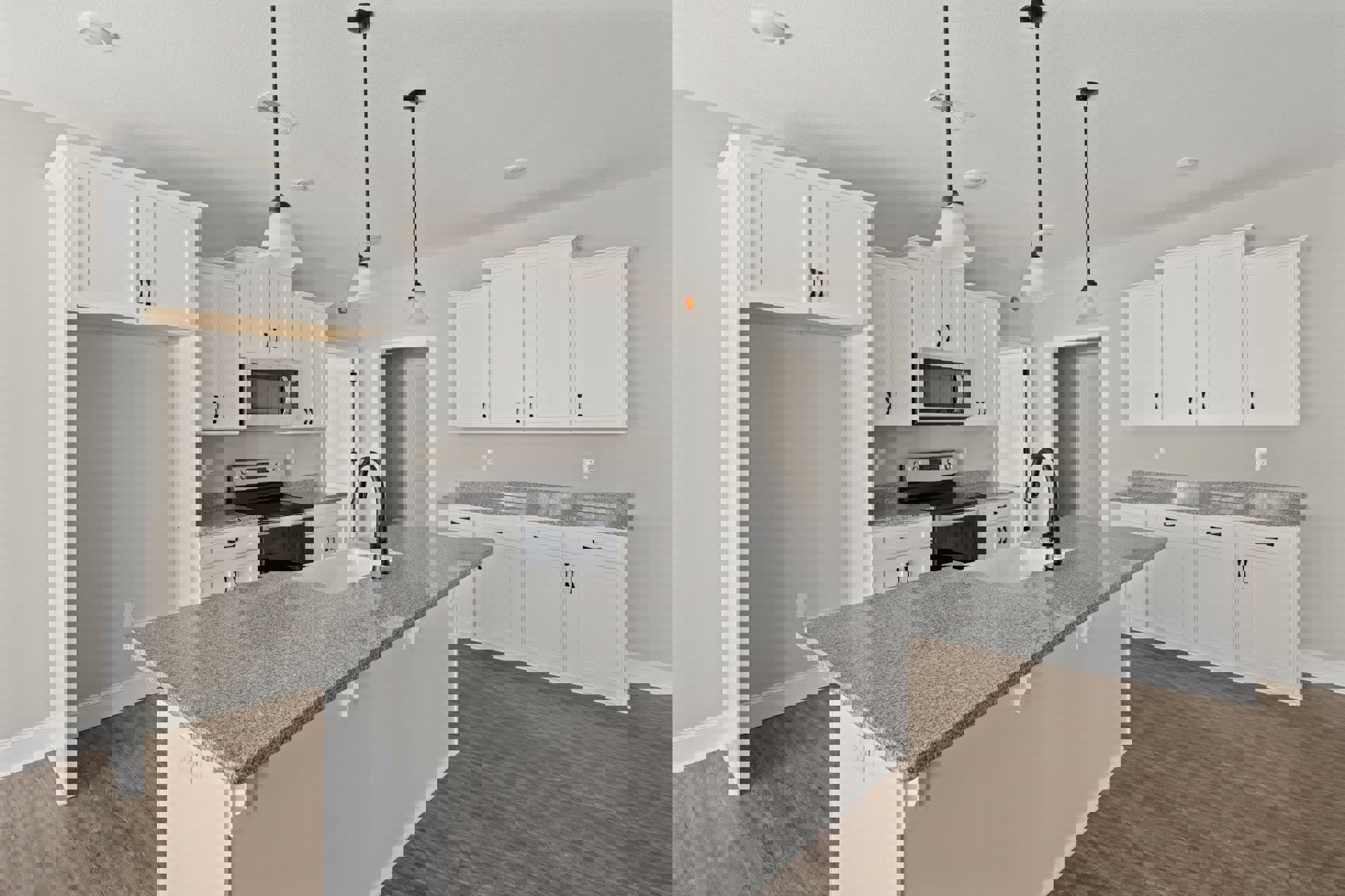 White kitchen cabinets, granite island countertop, stainless steel sink with black faucet, open microwave door, ceiling light fixture, neutral walls