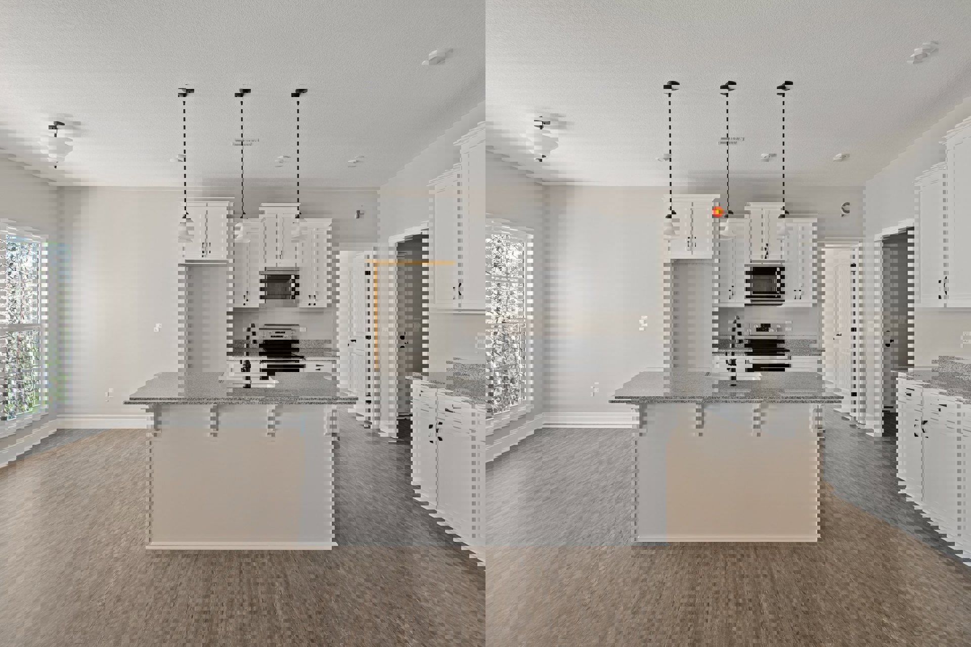 Open kitchen and dining area with light wood cabinetry, stainless steel microwave and oven, stone countertop with sink and faucet, large window overlooking trees, neutral walls and