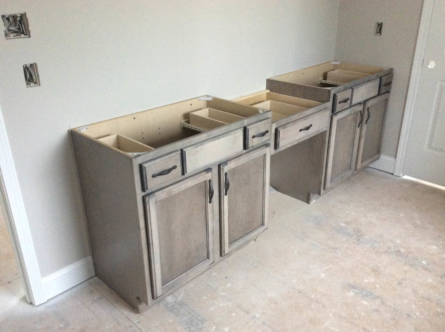White shaker kitchen cabinets with brushed nickel handles, quartz countertop, stainless steel sink, and light gray tile backsplash