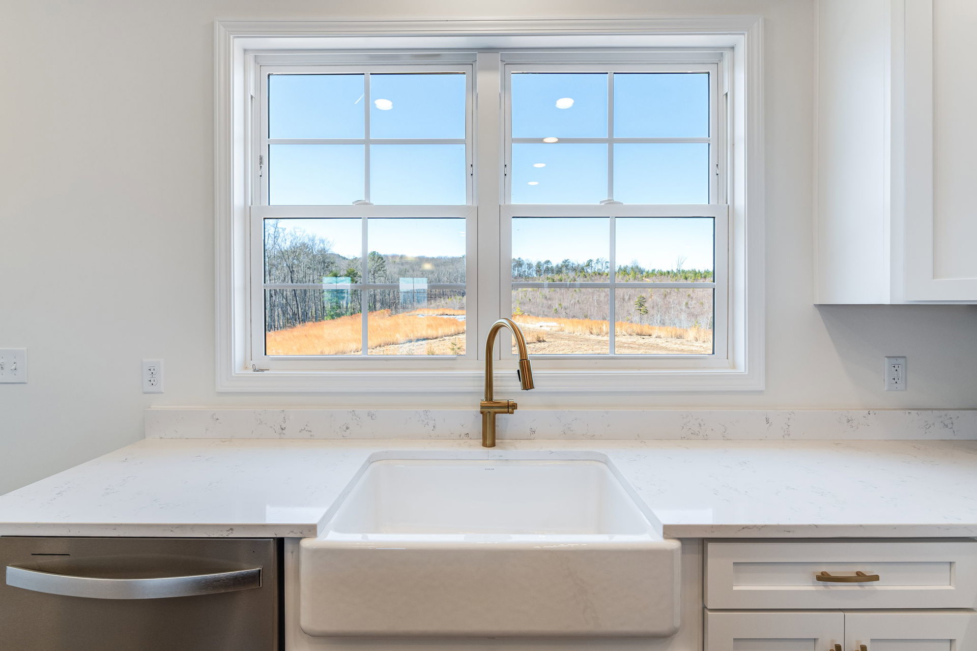 A kitchen sink with a window.