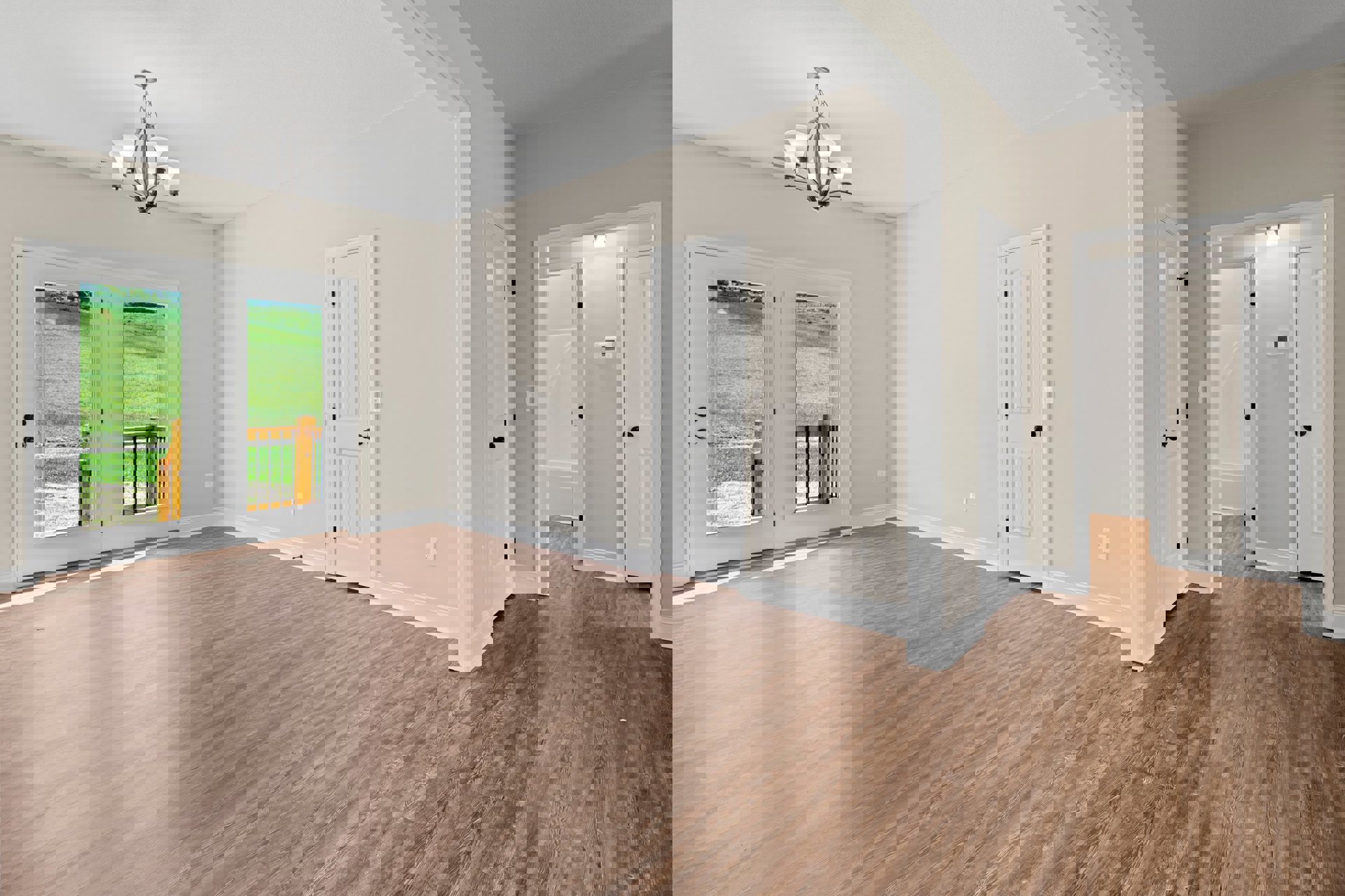 Wood flooring in a bright room, white door with black knob and glass panes, five-light chandelier overhead, window view of grassy field.