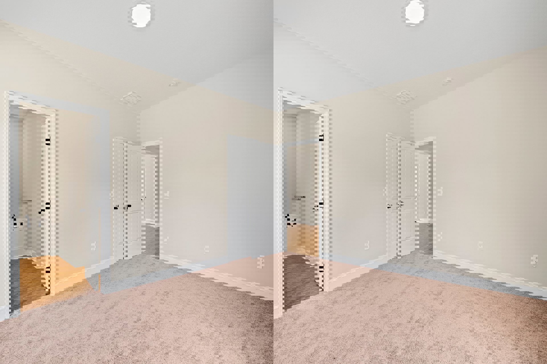 Beige carpeted floor, white walls, white door with black knob, round white ceiling light fixture, adjacent bathroom with bathtub visible through open doorway