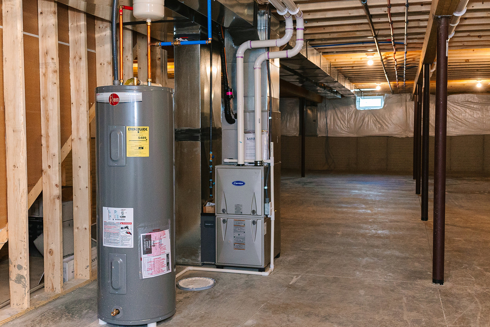 A large grey tank with pipes in a room.