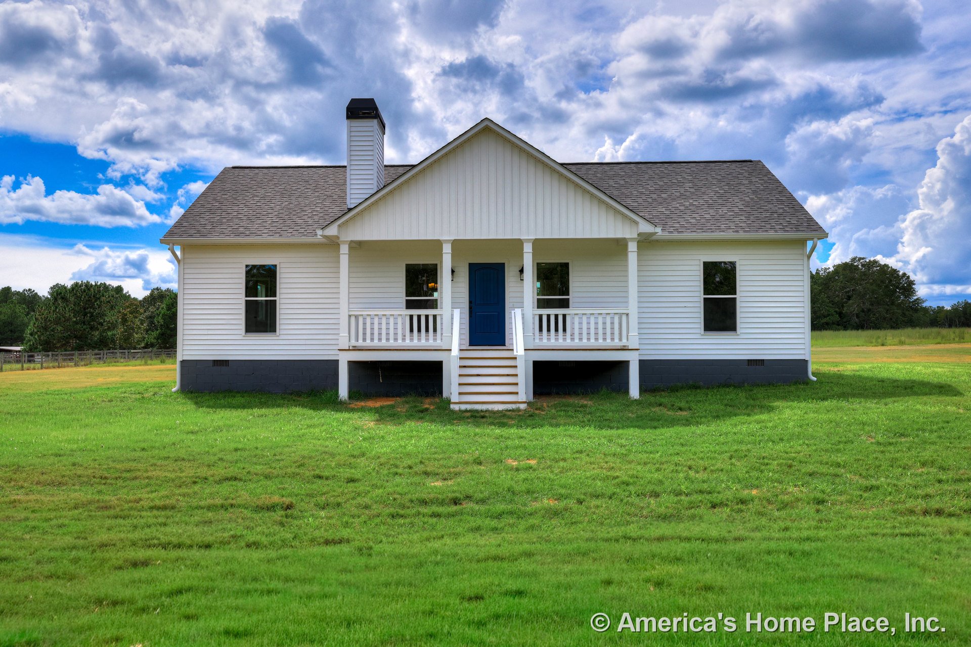 Covered front porch with white railing and columns, blue entry door, white horizontal siding, black chimney, gray shingle roof, raised foundation with steps, white trim around