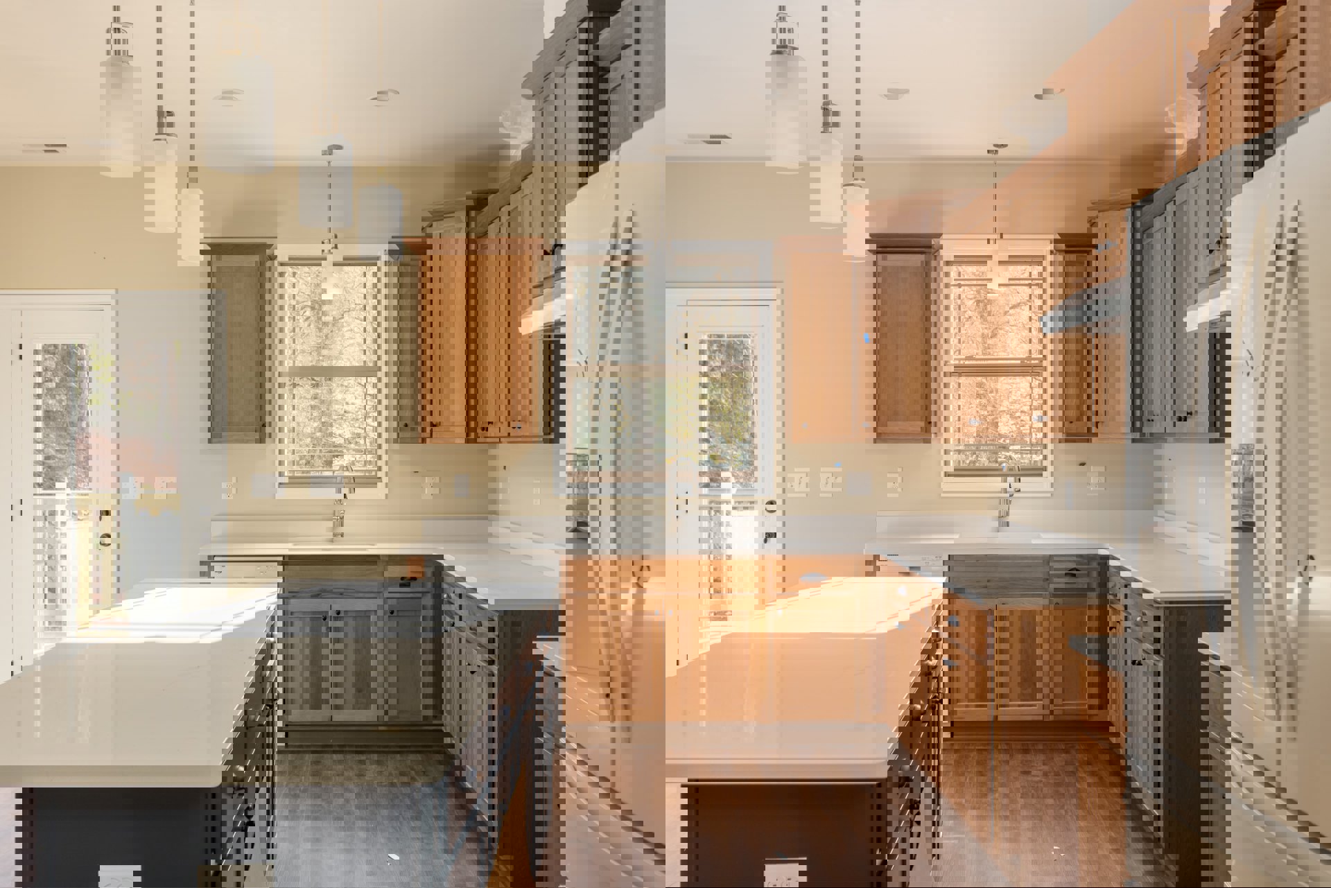 Kitchen with natural wood cabinets, white quartz countertops, stainless steel faucet under a window, white refrigerator with black number decals, light fixture above sink, hardwood