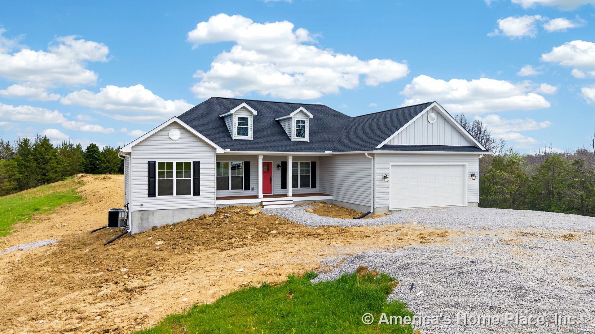White vinyl siding exterior with black shingle roof, double dormer windows, covered front porch supported by columns, red front door, attached two-car garage with paneled door