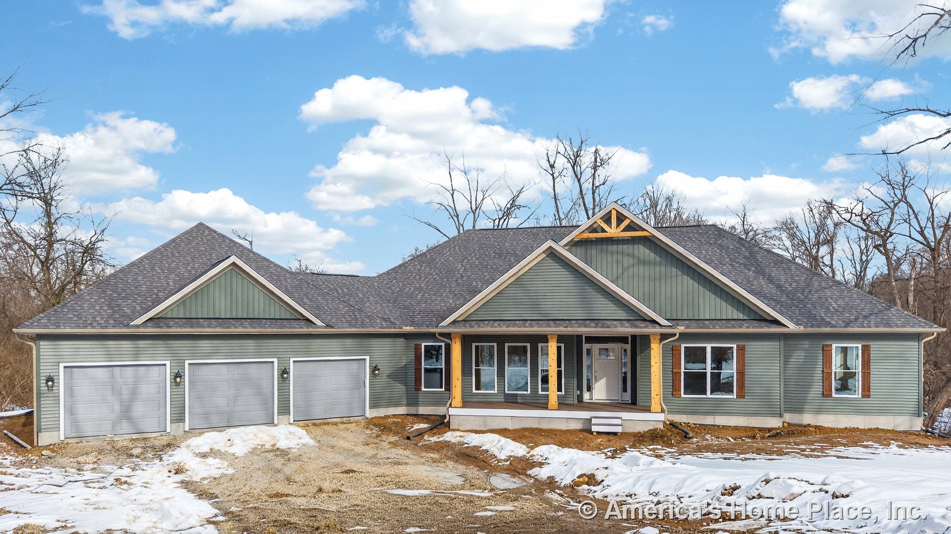 Three-car garage doors, covered front porch, green horizontal siding with wood trim accents, multiple front windows, gable roof with architectural shingles, new construction