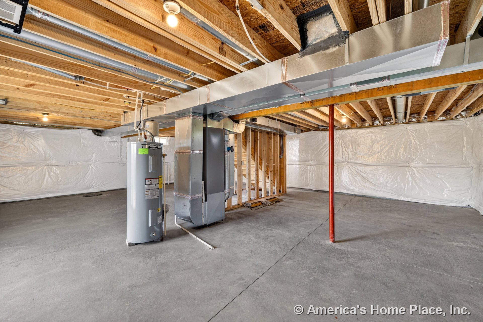 Unfinished basement with exposed wood ceiling joists, visible metal ductwork, concrete flooring, water heater unit, framed staircase wall, plastic-wrapped insulation, support