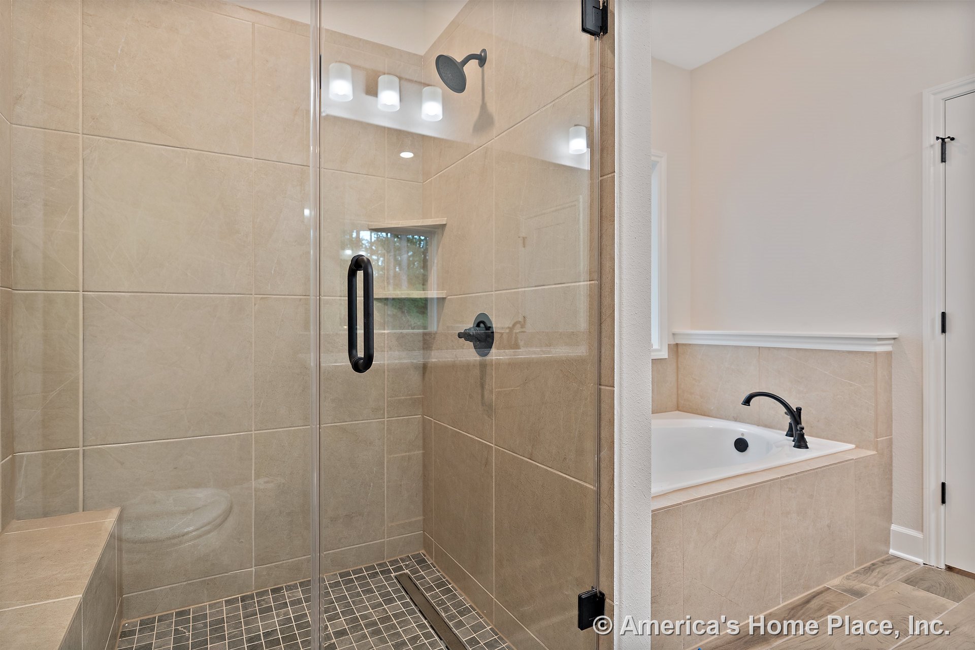 Walk-in shower with glass enclosure and beige tile walls, built-in soaking tub with matte black fixtures, tile flooring, recessed shower niche, modern lighting, window, and trim.