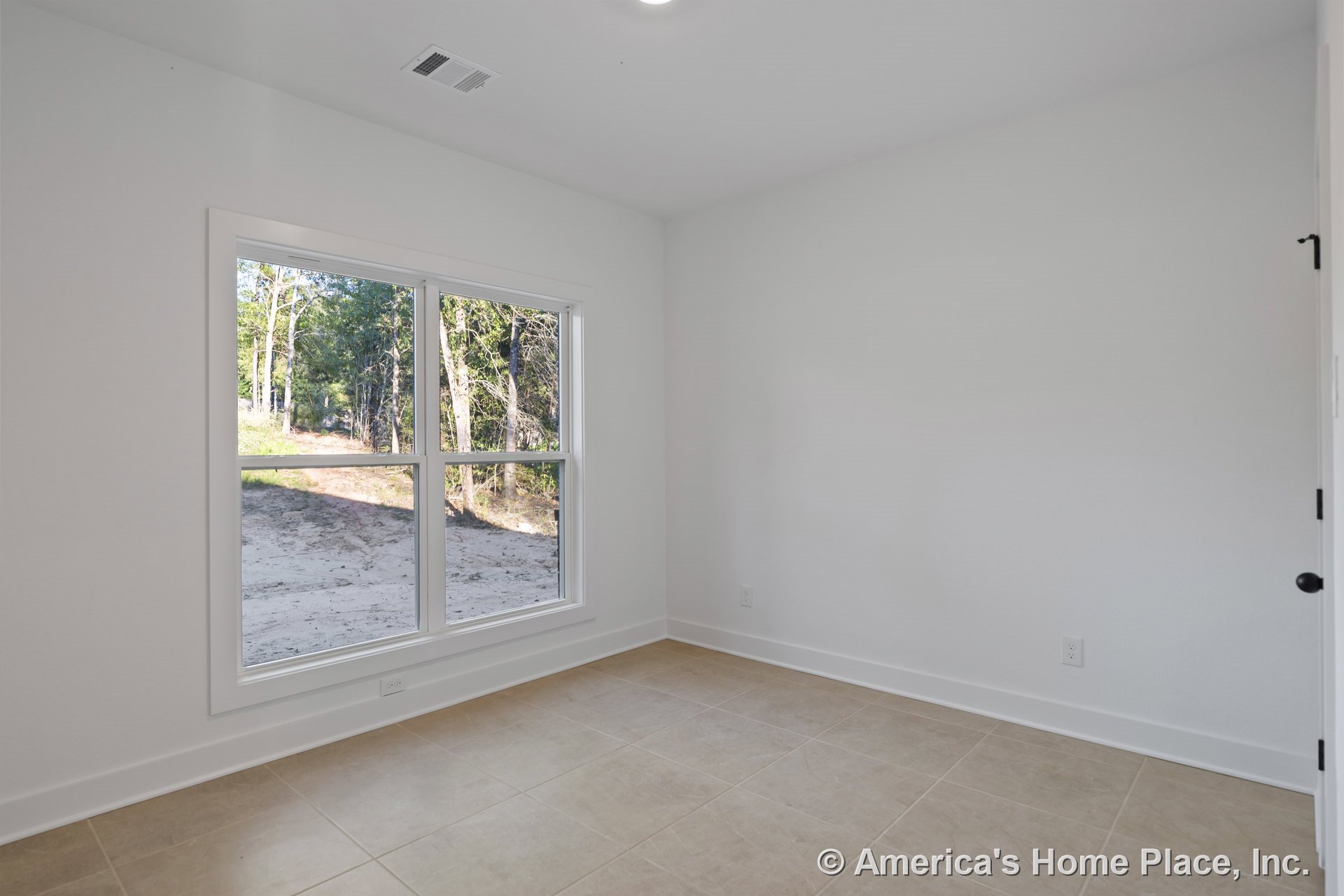 Large double windows with white frames, beige ceramic tile flooring, white baseboards, smooth white walls, recessed ceiling light, ceiling vent, and wall outlet in an empty room