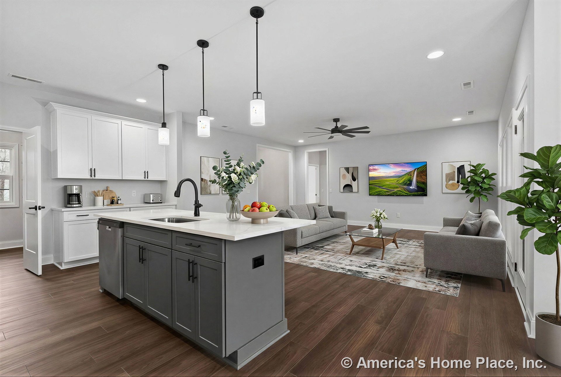 Open-concept kitchen and living area with white upper cabinets, gray kitchen island topped with quartz countertops, pendant lights above the island, wood-look plank flooring