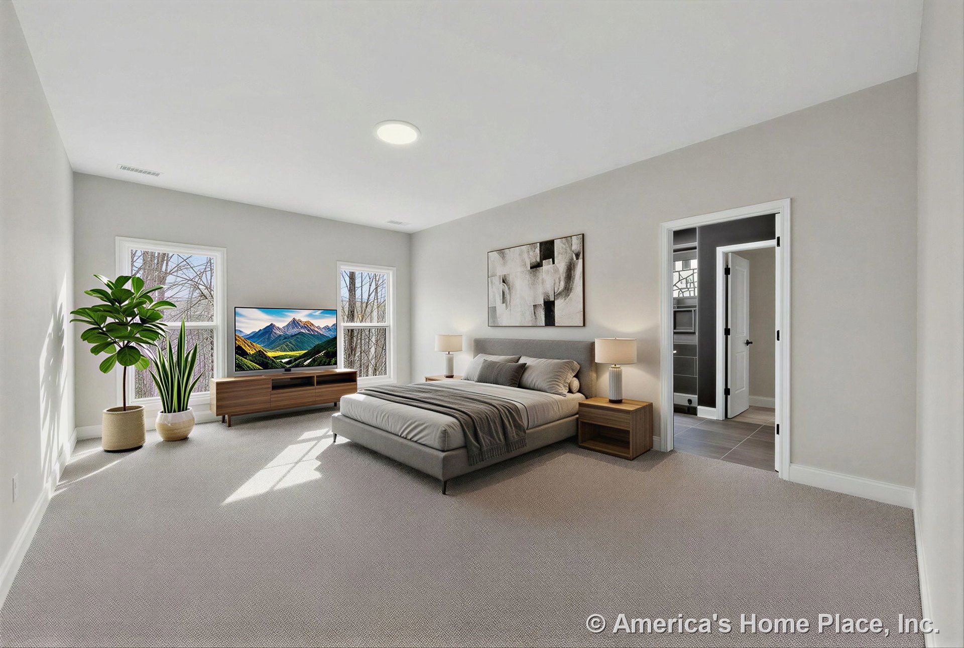 Light gray carpeted primary bedroom with two large windows, white trim and baseboards, recessed ceiling light, neutral gray walls, and doorway leading to en suite bathroom.