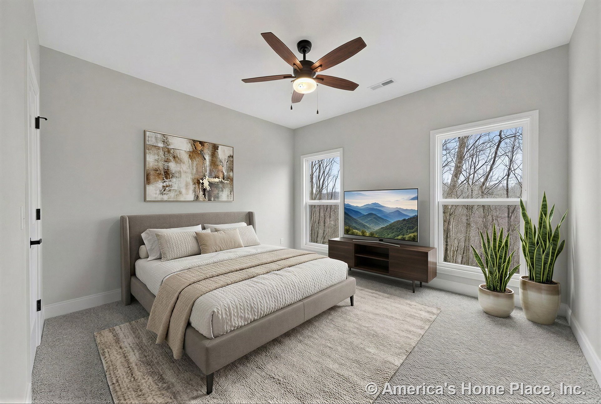 Bedroom with large double windows framed in white trim, neutral carpet flooring, ceiling fan with integrated light fixture, white painted walls, modern interior door, and baseboard