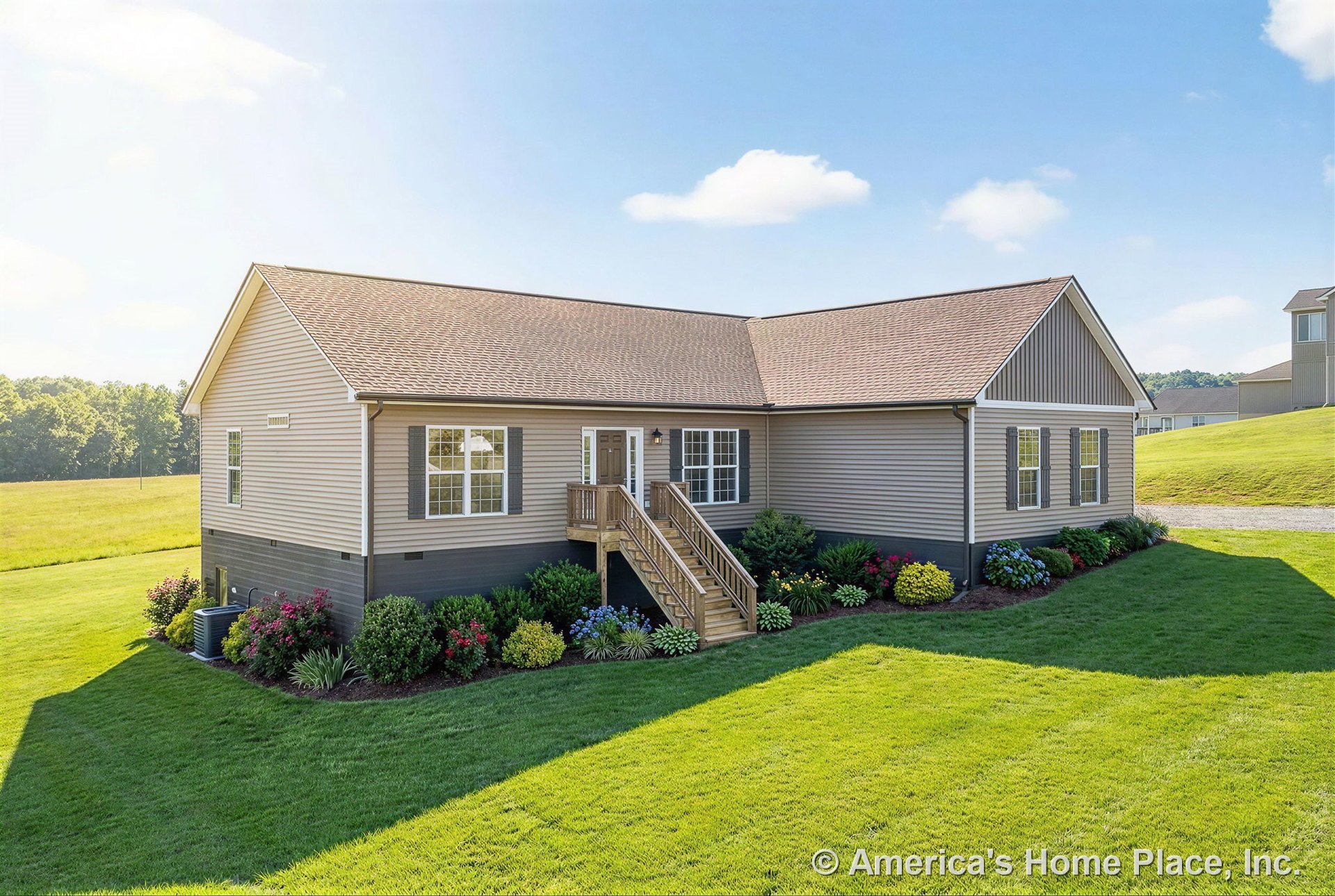 Beige vinyl siding exterior with gable roof, double-hung windows, wooden entry porch featuring stairs and railings, landscaped foundation plantings along front entry.