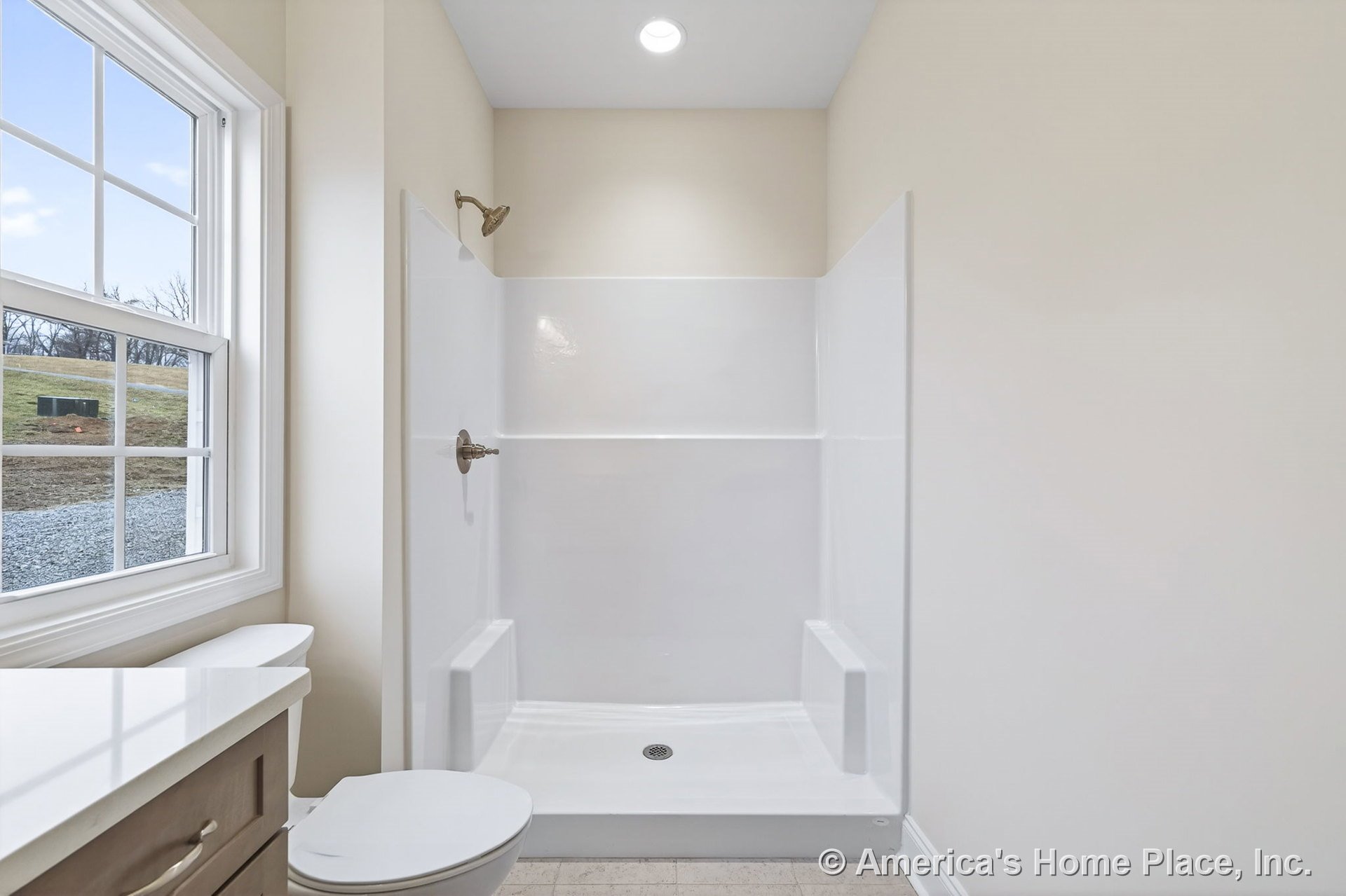 Walk-in shower with built-in seats, stone countertop vanity, window with white trim, recessed ceiling light, neutral wall paint, tile flooring, and toilet.