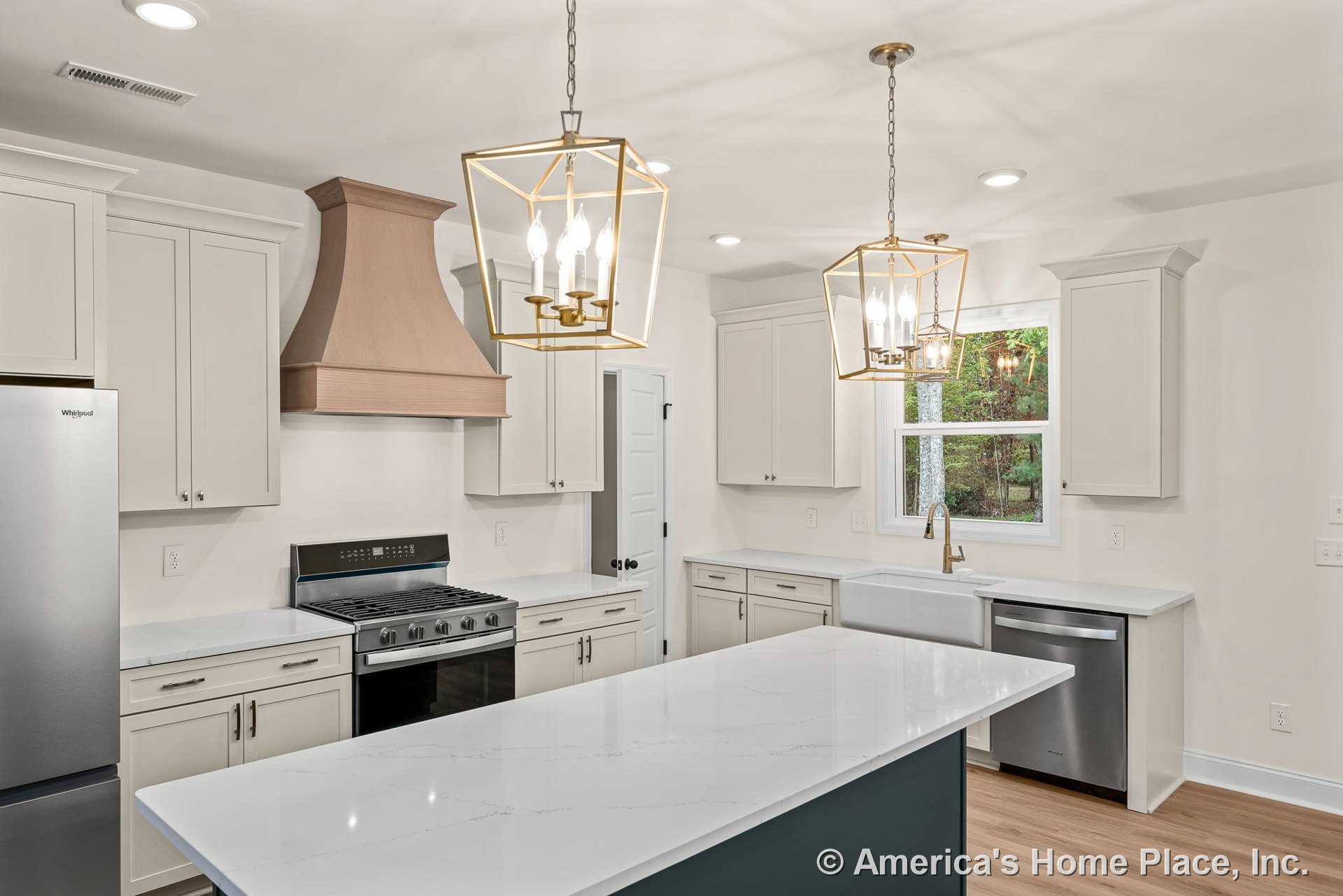 Shaker-style cabinets with wood range hood, quartz countertops, farmhouse sink, stainless steel appliances, pendant lighting, window with trim, and hardwood flooring.