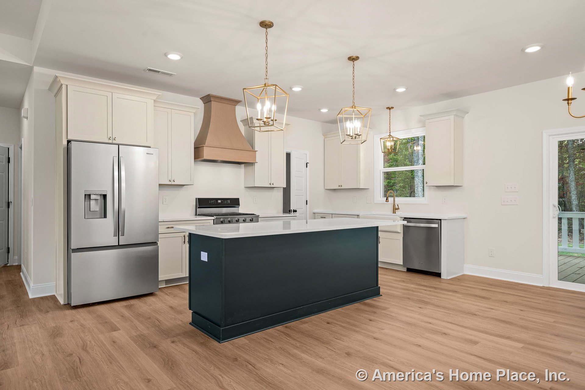 Shaker cabinetry with wood range hood, quartz countertops, stainless steel appliances, pendant lights above central island, wide plank wood flooring, window with trim.