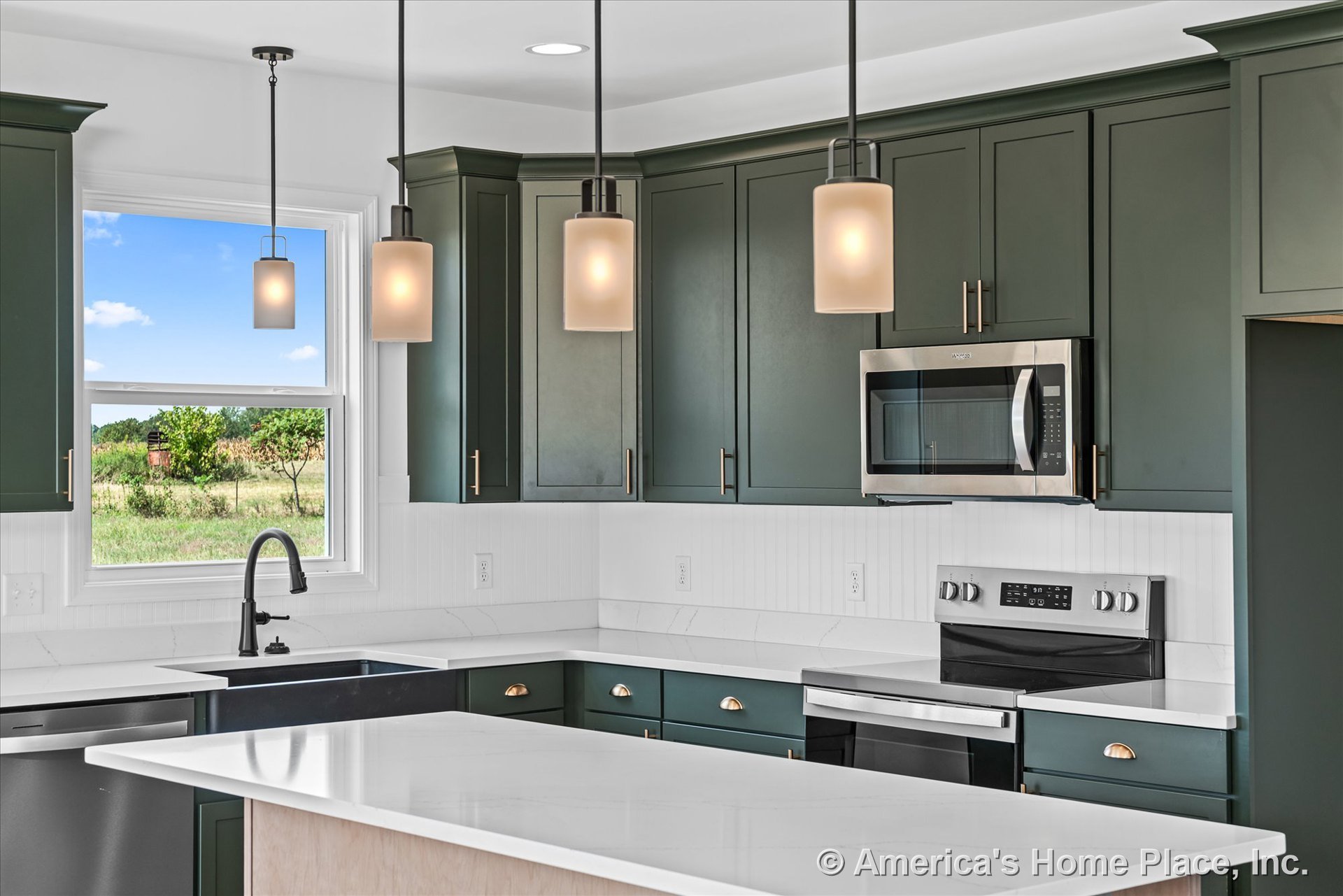Green shaker cabinetry with white quartz countertops, stainless steel appliances, white tile backsplash, black single-handle faucet, undermount sink, and modern pendant lighting.