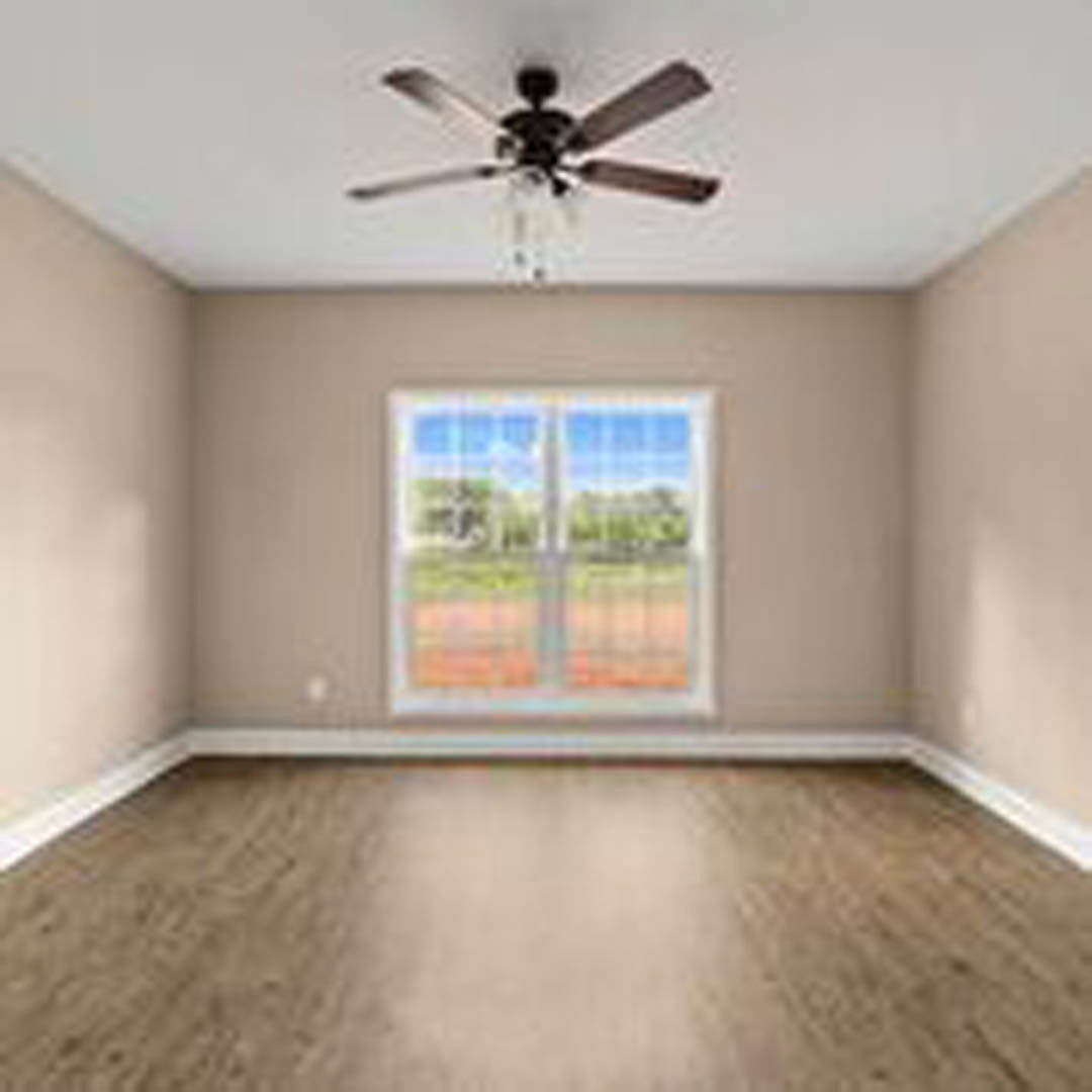 Living room with wood laminate flooring, white plaster walls, ceiling fan with light fixture, large window showing outdoor greenery