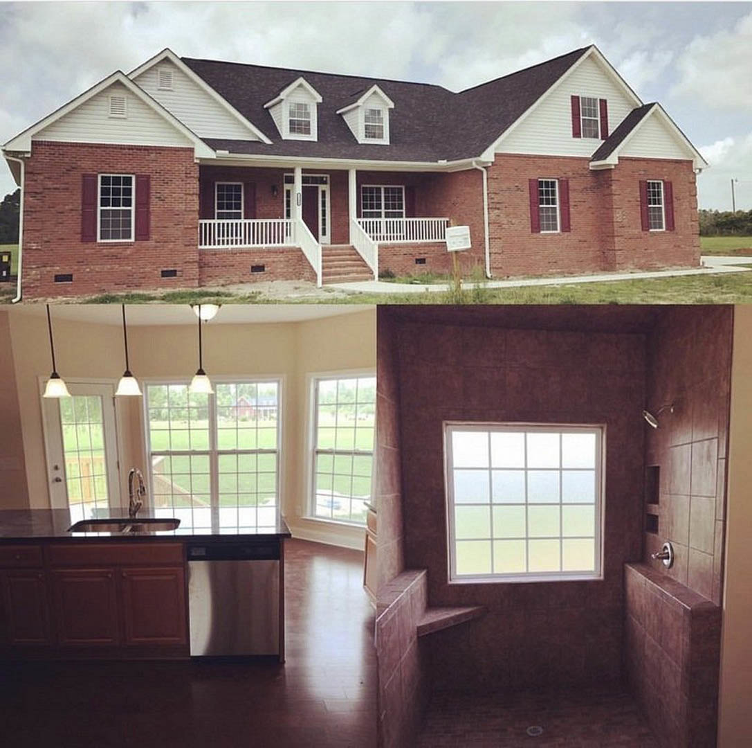 Red brick home with prominent large window featuring multiple white-paned squares, white railing along entry steps, cloudy sky above