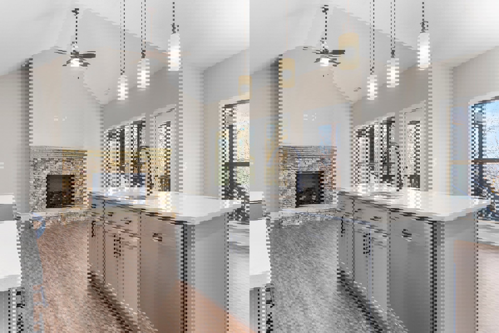 Kitchen with stone fireplace, ceiling fan with light, white countertops, wood cabinetry, stainless steel sink, and tiled floor.