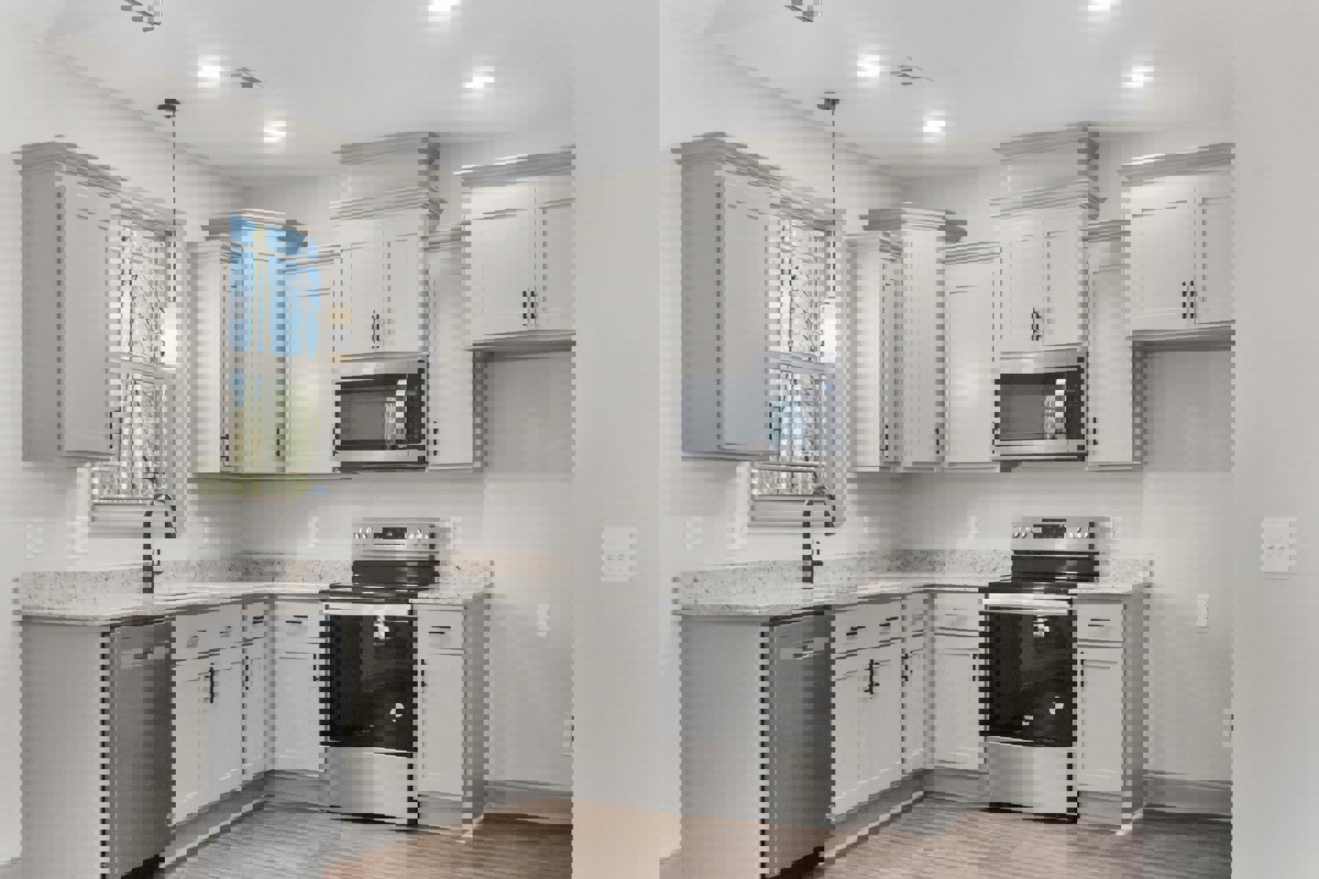 White shaker cabinets, black freestanding stove, stainless steel oven with glass door, built-in microwave, light stone countertops, undermount sink, neutral tile backsplash, large