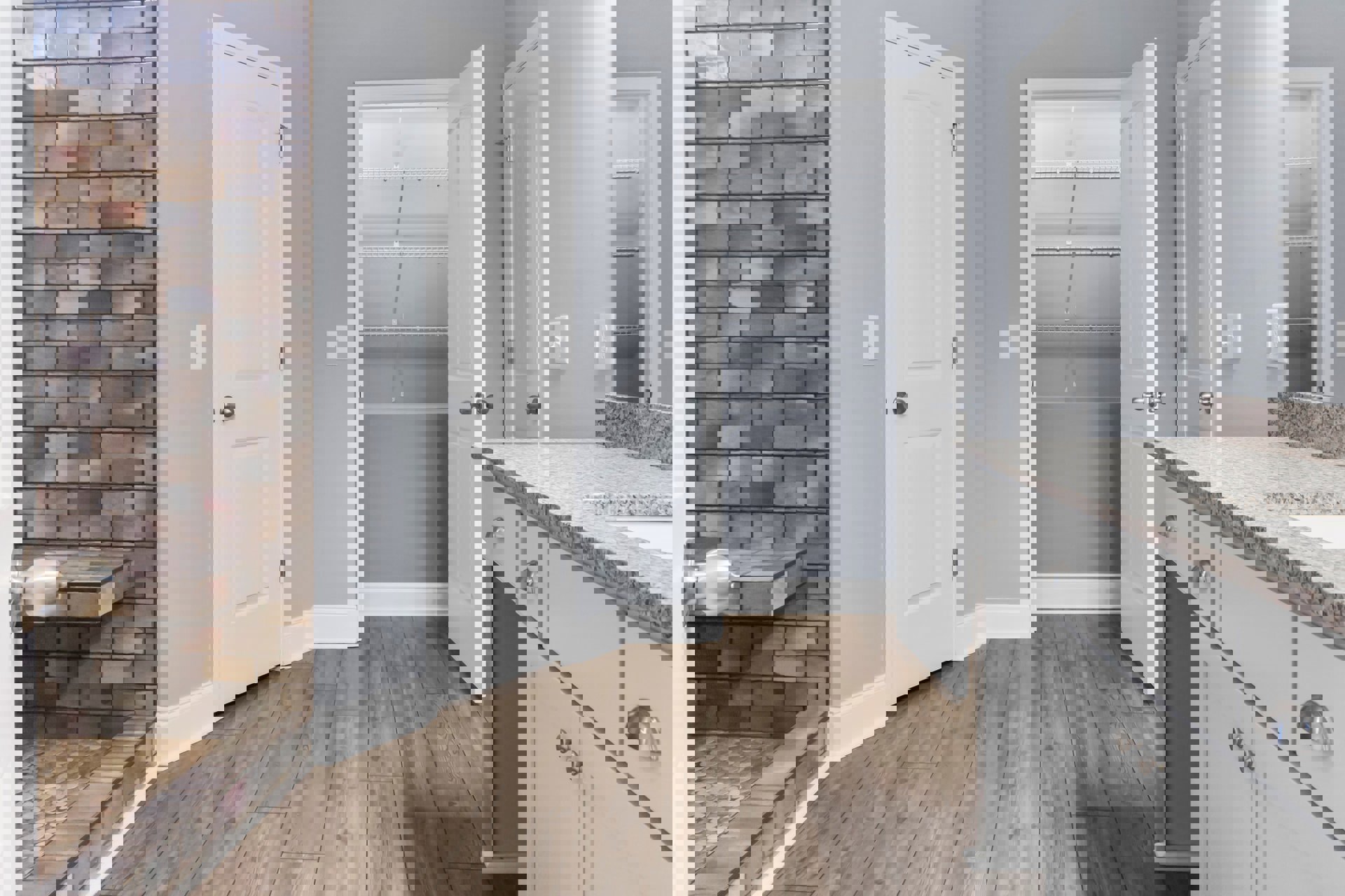 Wood floor with white trim, open white door with silver knob, brick accent wall, white closet shelving, tile and stone flooring, kitchen cabinetry and granite countertop visible.