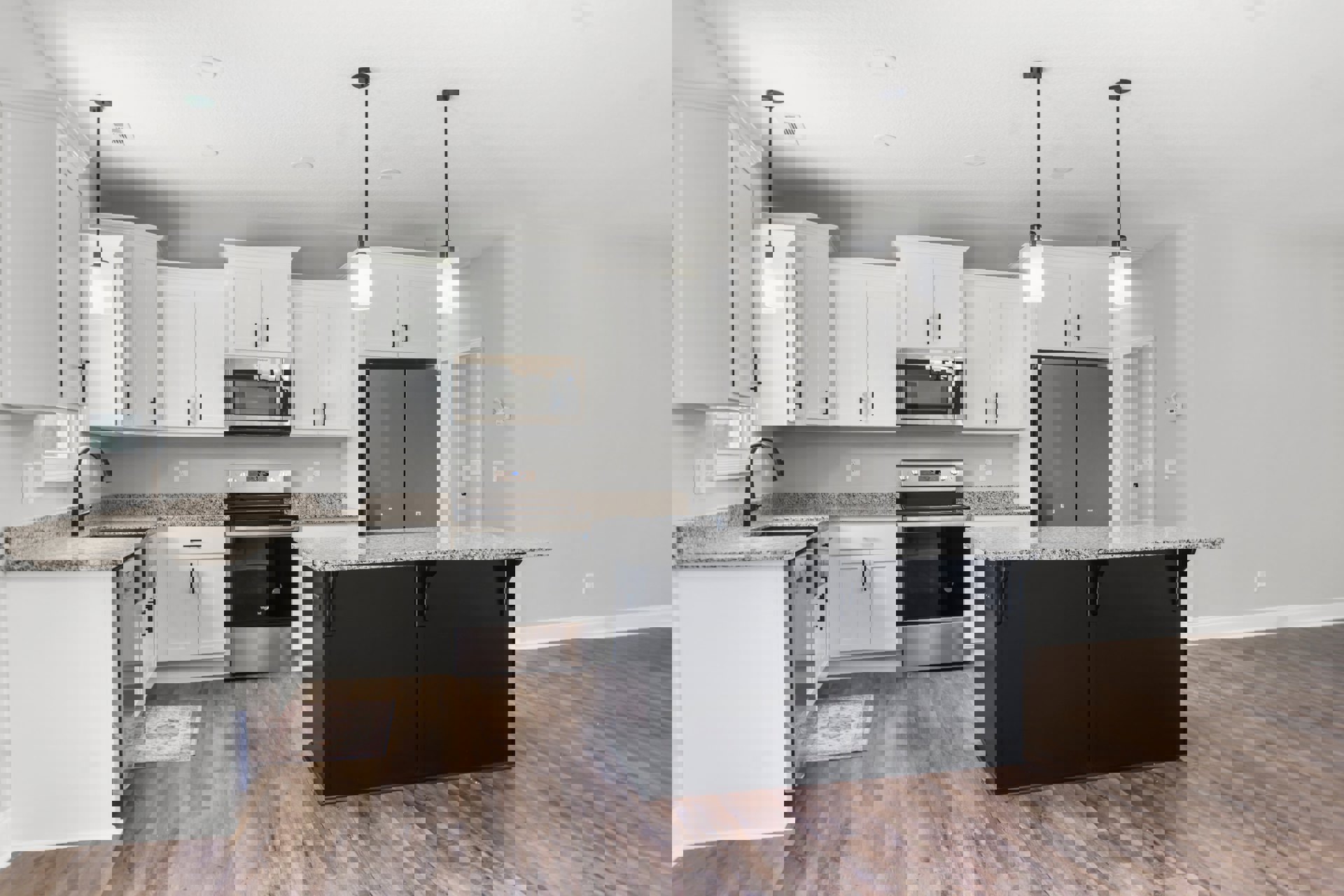 Marble island with waterfall edge, stainless steel appliances including double-door refrigerator and built-in microwave, white cabinetry, granite countertops, black and white