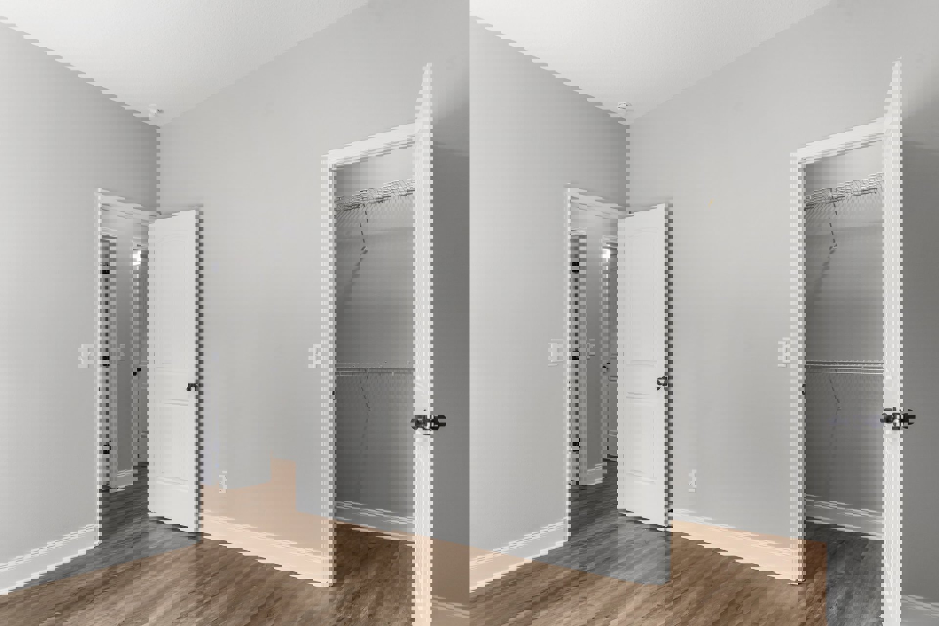 White walls and ceiling, wood plank flooring, open white door with black knob, white closet door, minimalist interior.