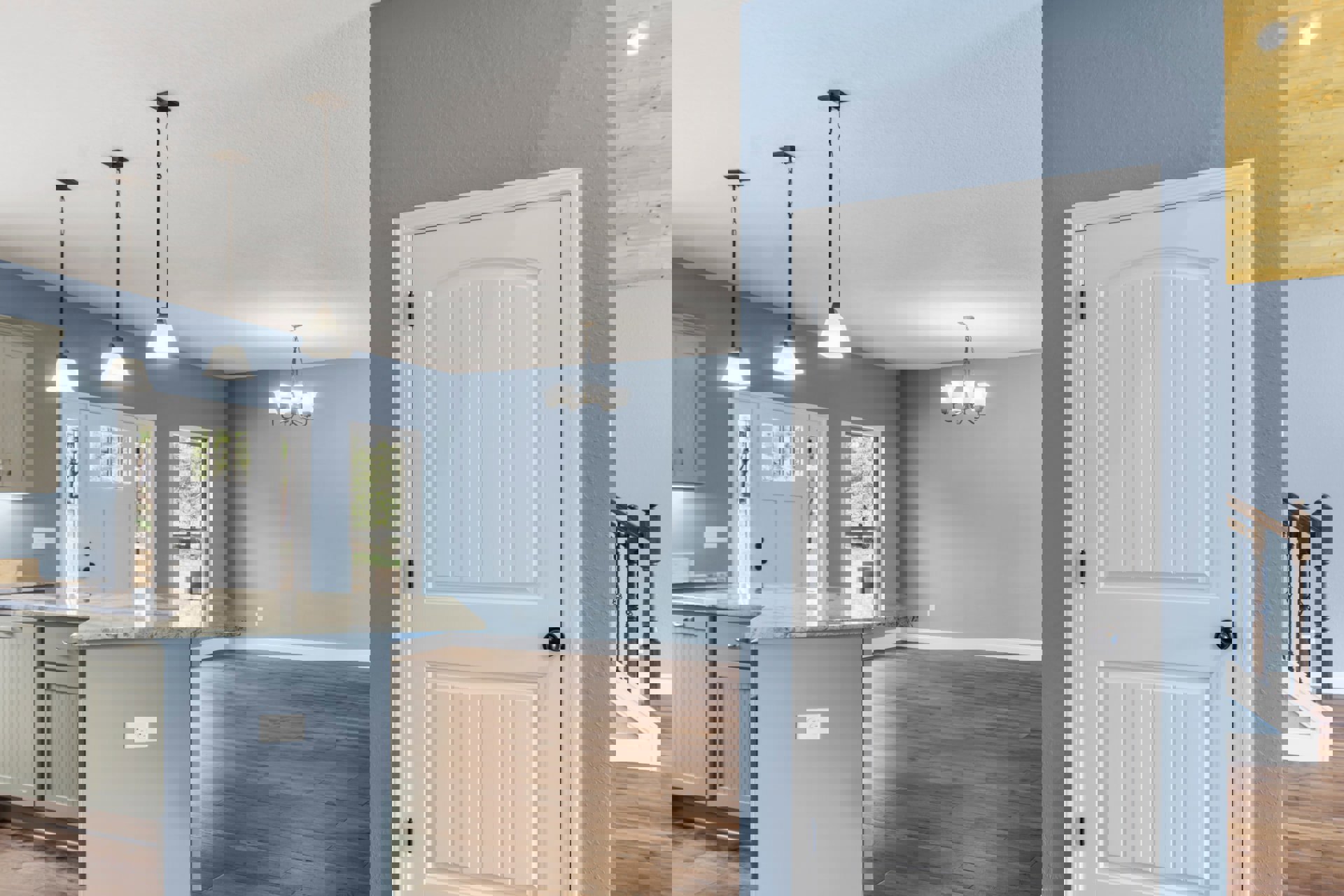 White paneled door with black hardware set in a neutral-toned room, adjacent to built-in cabinetry and light wood flooring