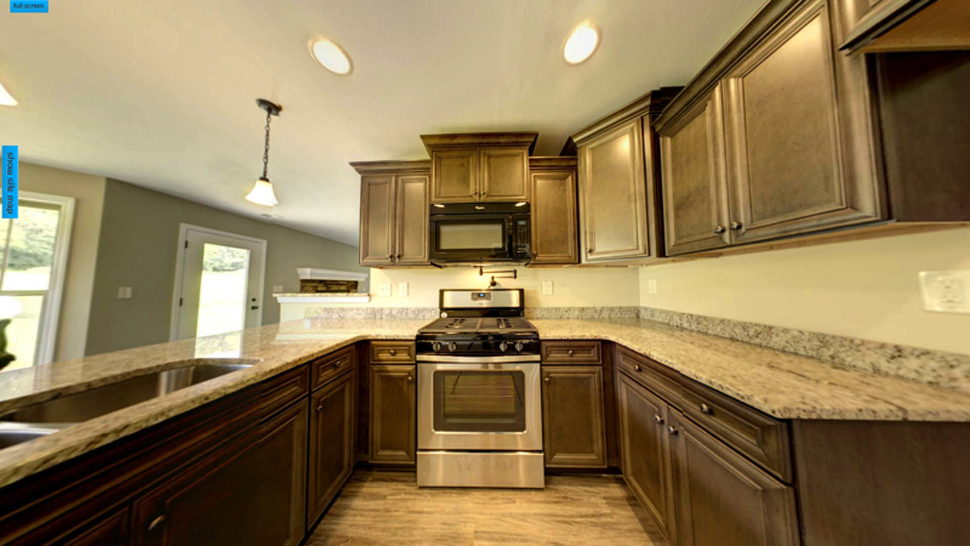 White shaker cabinets, stainless steel stove, quartz countertops, undermount sink, tile backsplash, and brushed nickel hardware in a modern kitchen