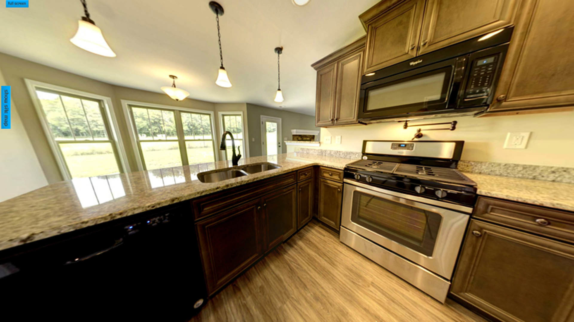 Marble countertop kitchen with stainless steel stove, white cabinetry, built-in microwave, and light switch on neutral wall
