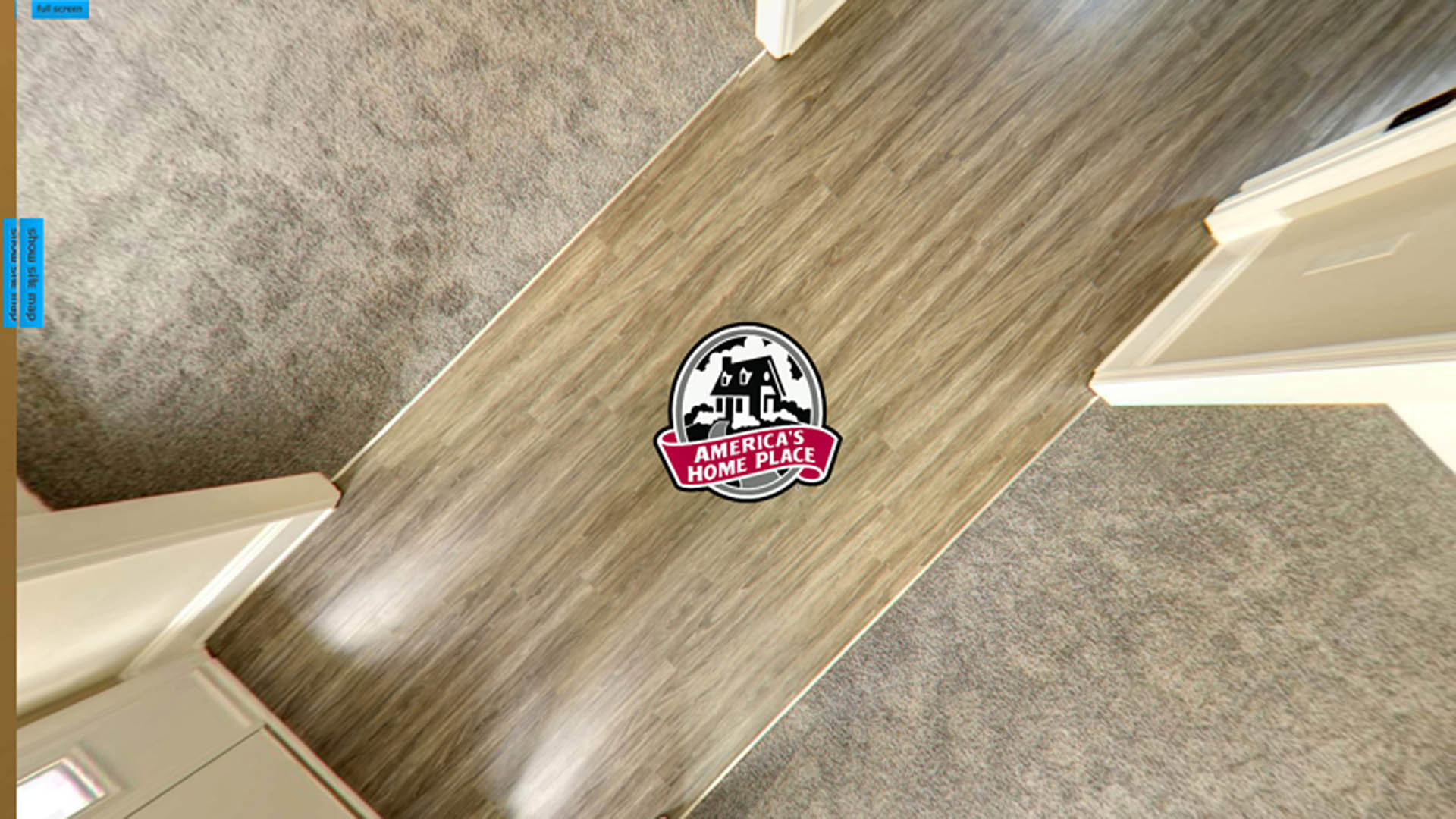 Red and white house logo sticker on light wood floor near white door, blue sign with black text on wall in background