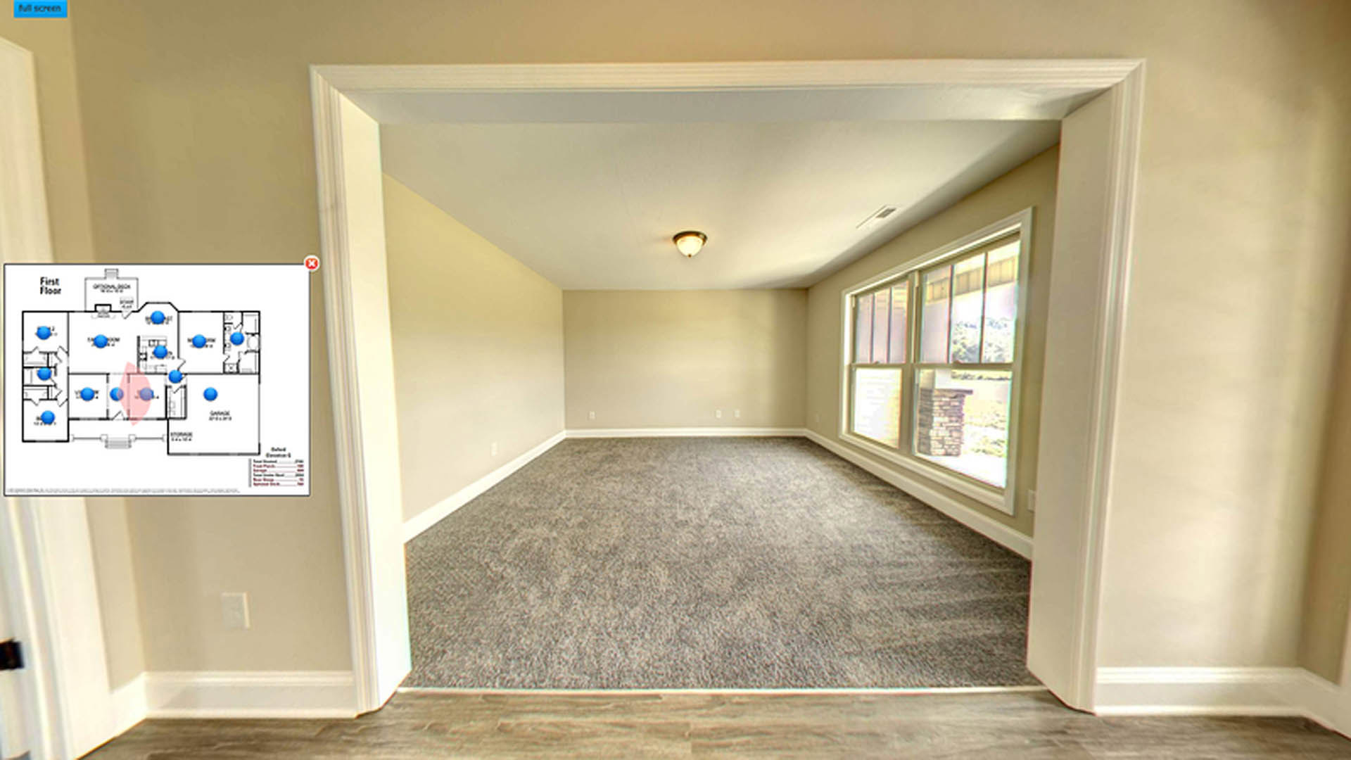 Carpeted room featuring a large window, white walls, and ceiling with recessed lighting fixtures