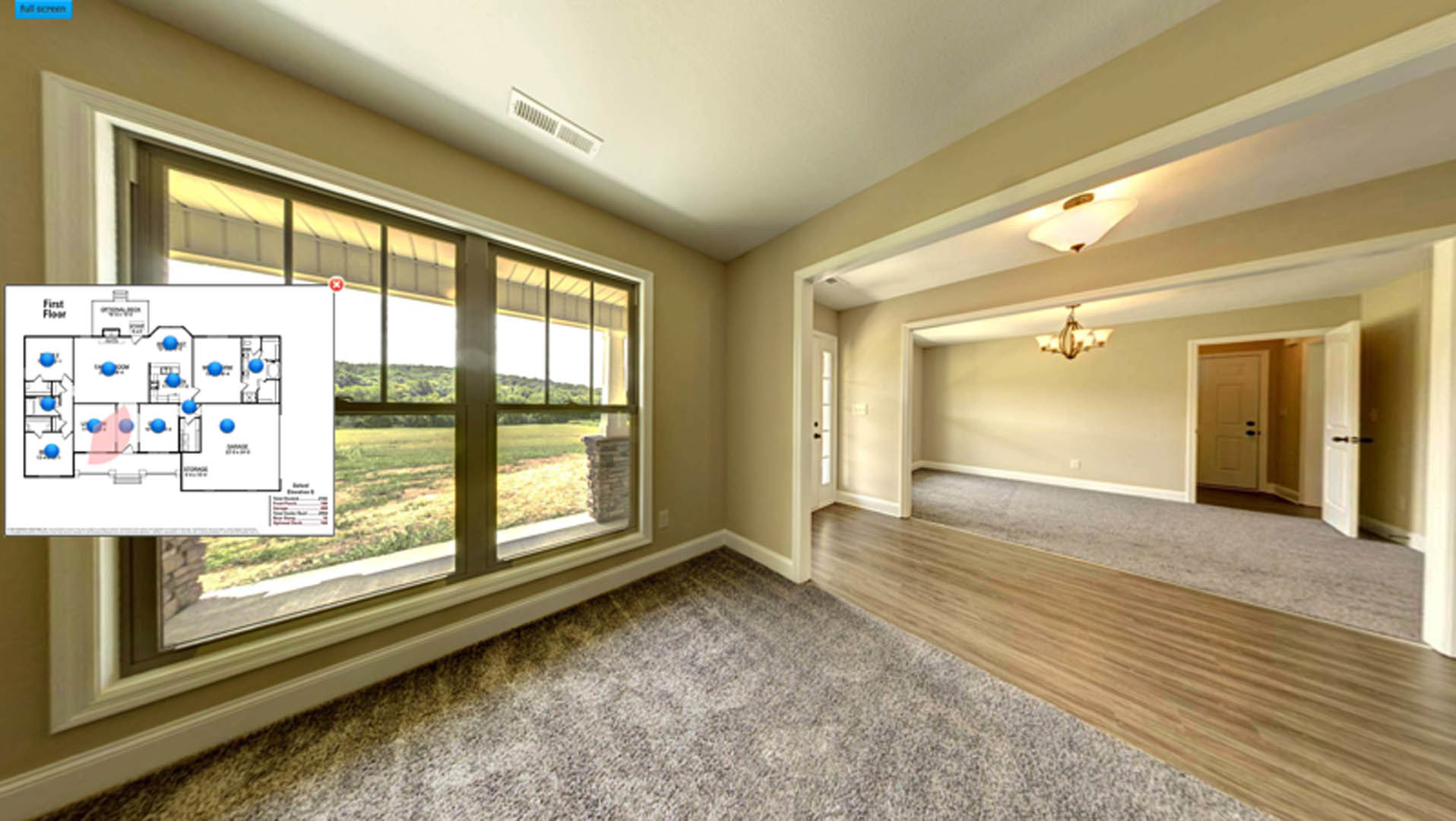 Spacious room featuring wide plank wood flooring, expansive window with white trim, smooth white walls, and recessed ceiling lighting