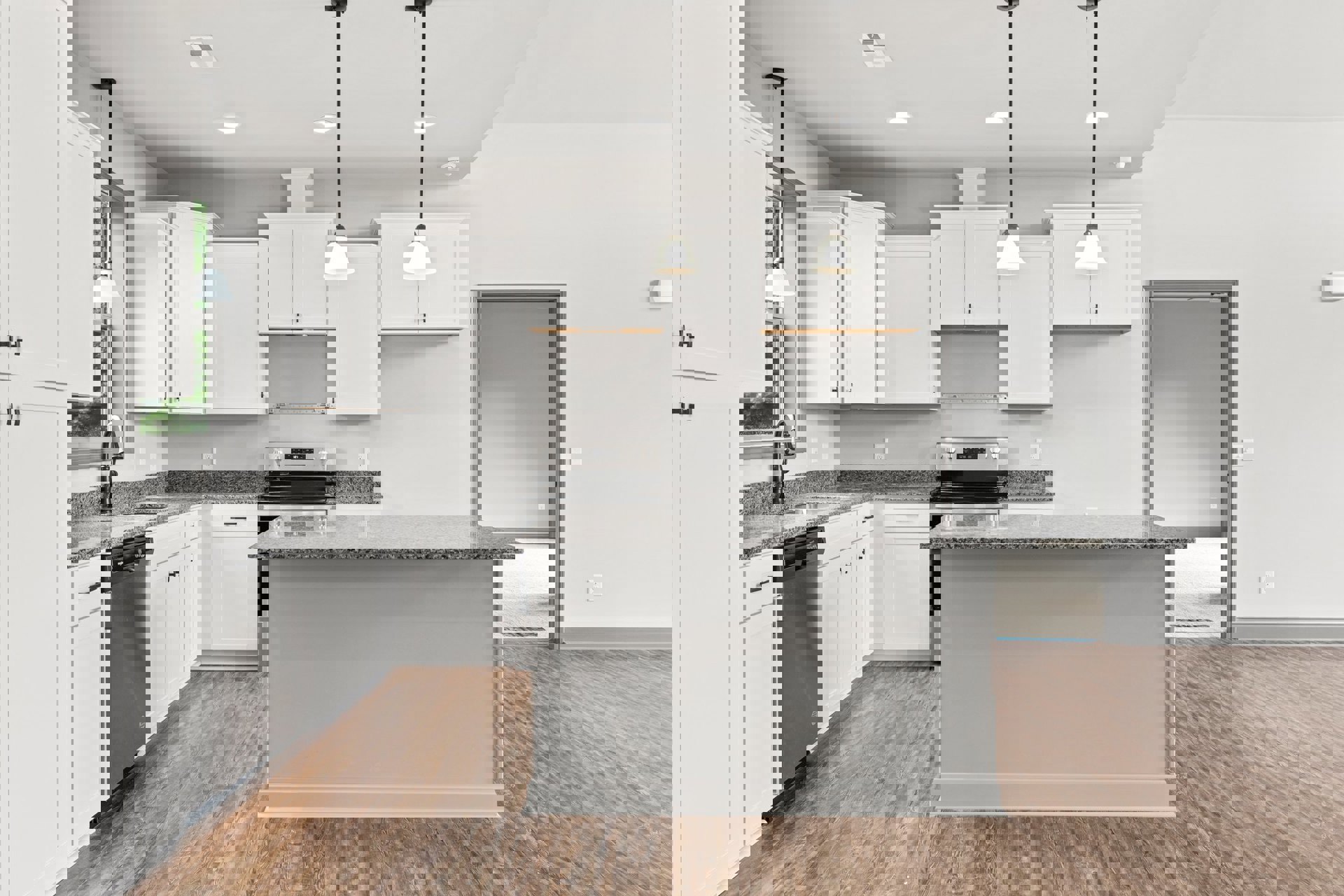 Modern kitchen featuring black and white quartz countertop, white cabinetry, stainless steel faucet, built-in stove, and light fixture against a white wall