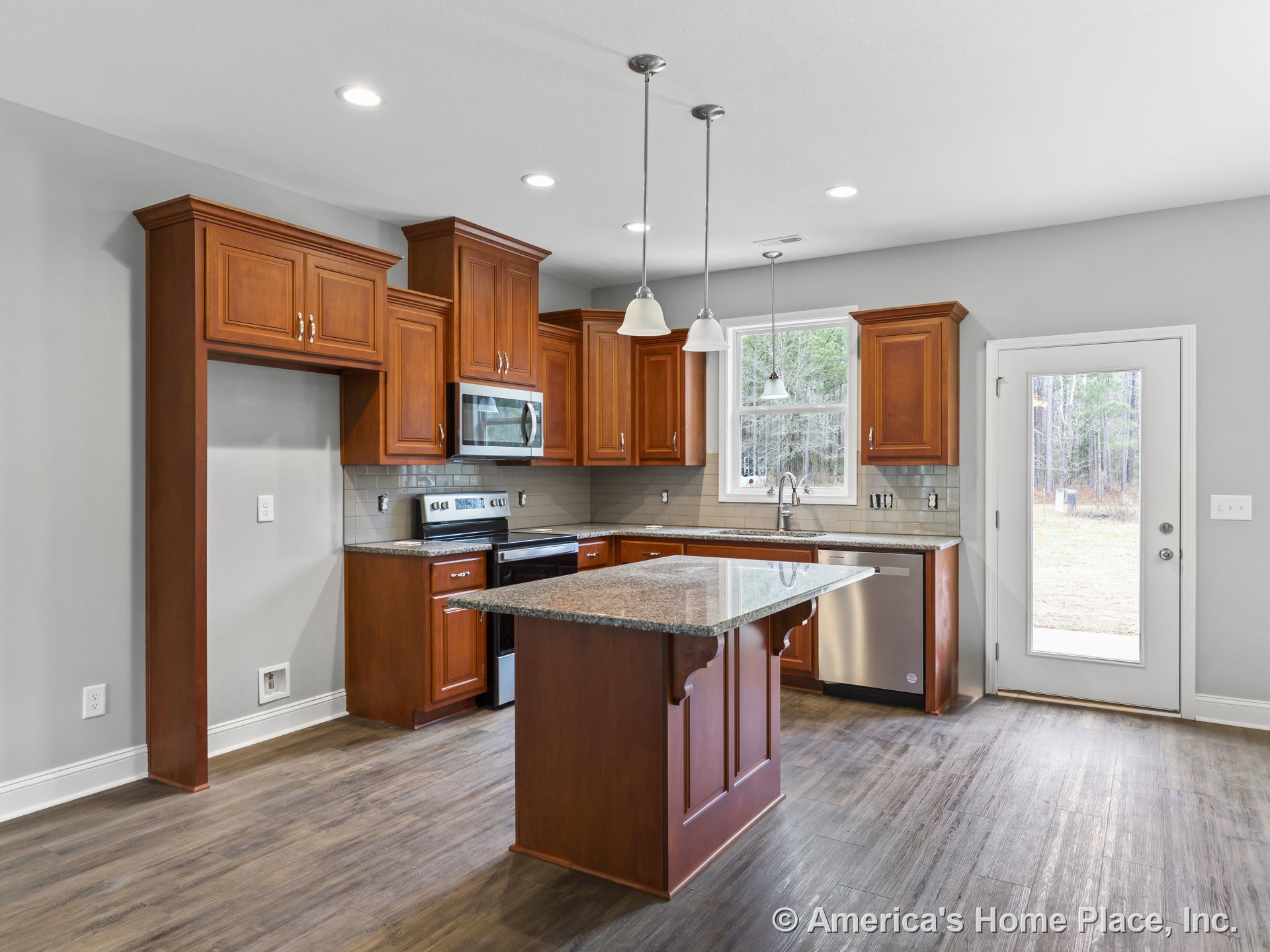 Custom kitchen with wood cabinetry, granite countertops, center island, tile backsplash, stainless steel appliances including built-in microwave, pendant and recessed lighting