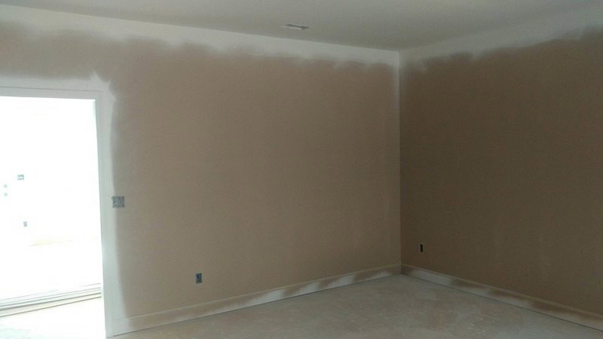 White-painted walls, light-colored flooring, ceiling light fixture, closed door, and window in a modern residential room