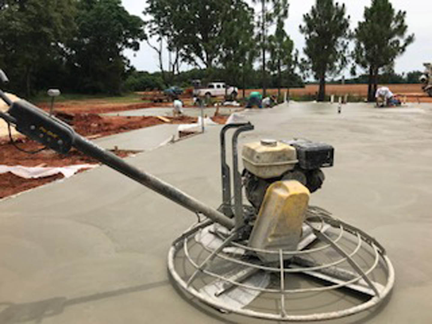 Polished concrete floor in an outdoor area with industrial machine placed near the entrance