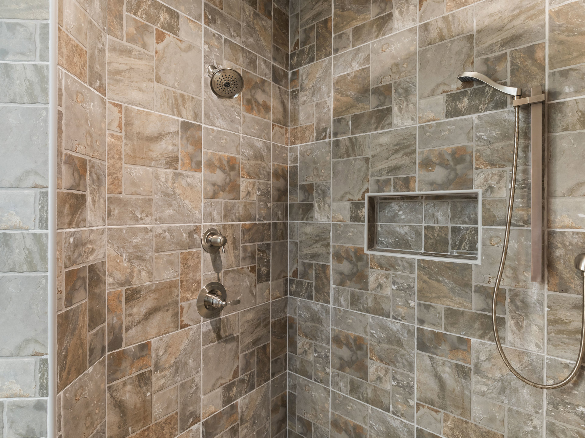 A shower with a shower head and a shower head.