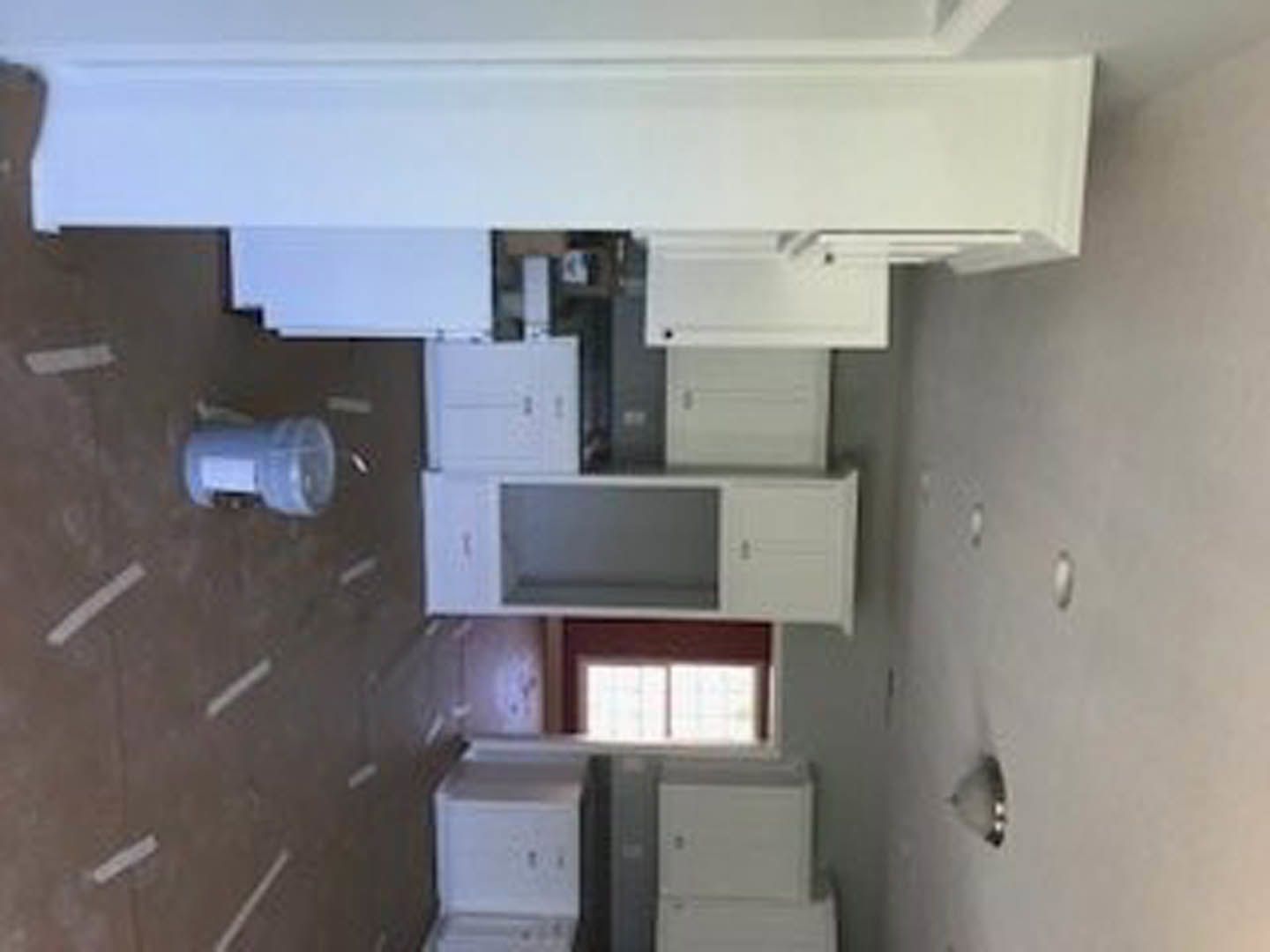 Kitchen with white shaker cabinets, white plaster ceiling, stainless steel appliances, and light quartz countertops