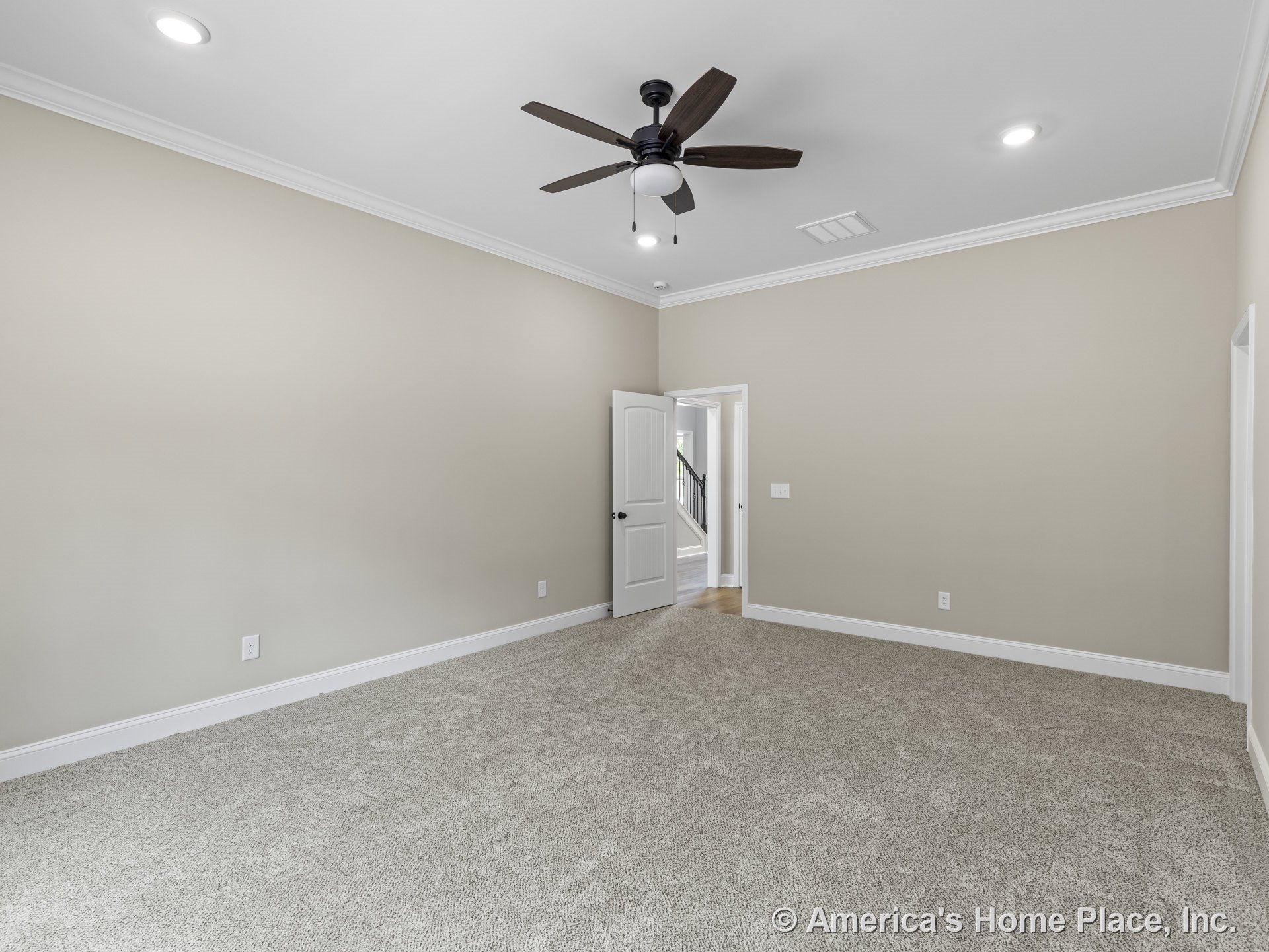 Carpeted bedroom with neutral walls, white trim and baseboards, crown molding, recessed ceiling lights, ceiling fan with light, and open doorway.