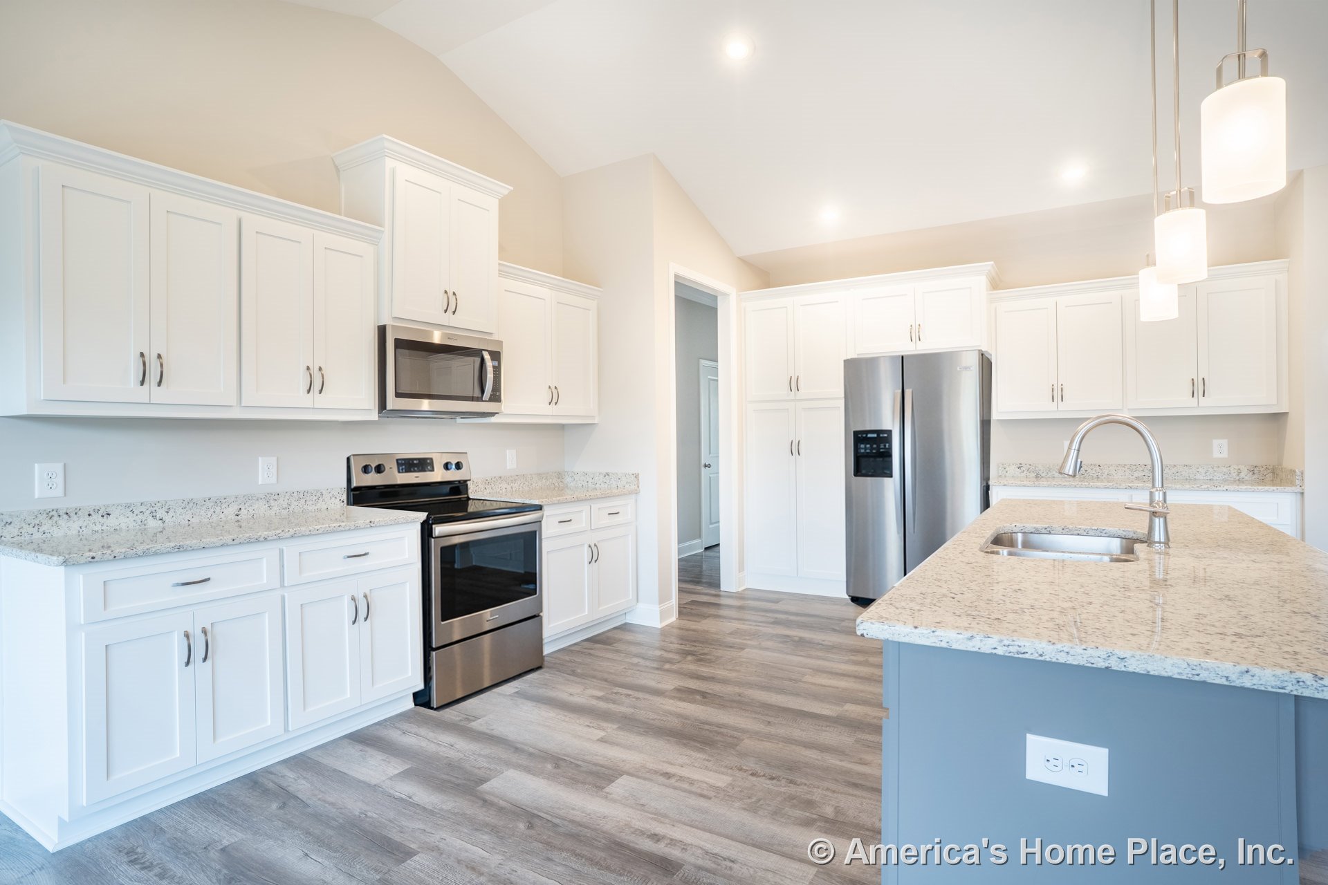 White shaker cabinets with granite countertops, stainless steel appliances, pendant lighting fixtures, wood-look vinyl flooring, and an undermount sink with a gooseneck faucet.