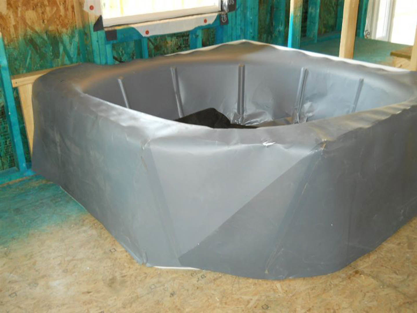 A grey plastic wrapped in a plastic sheet.