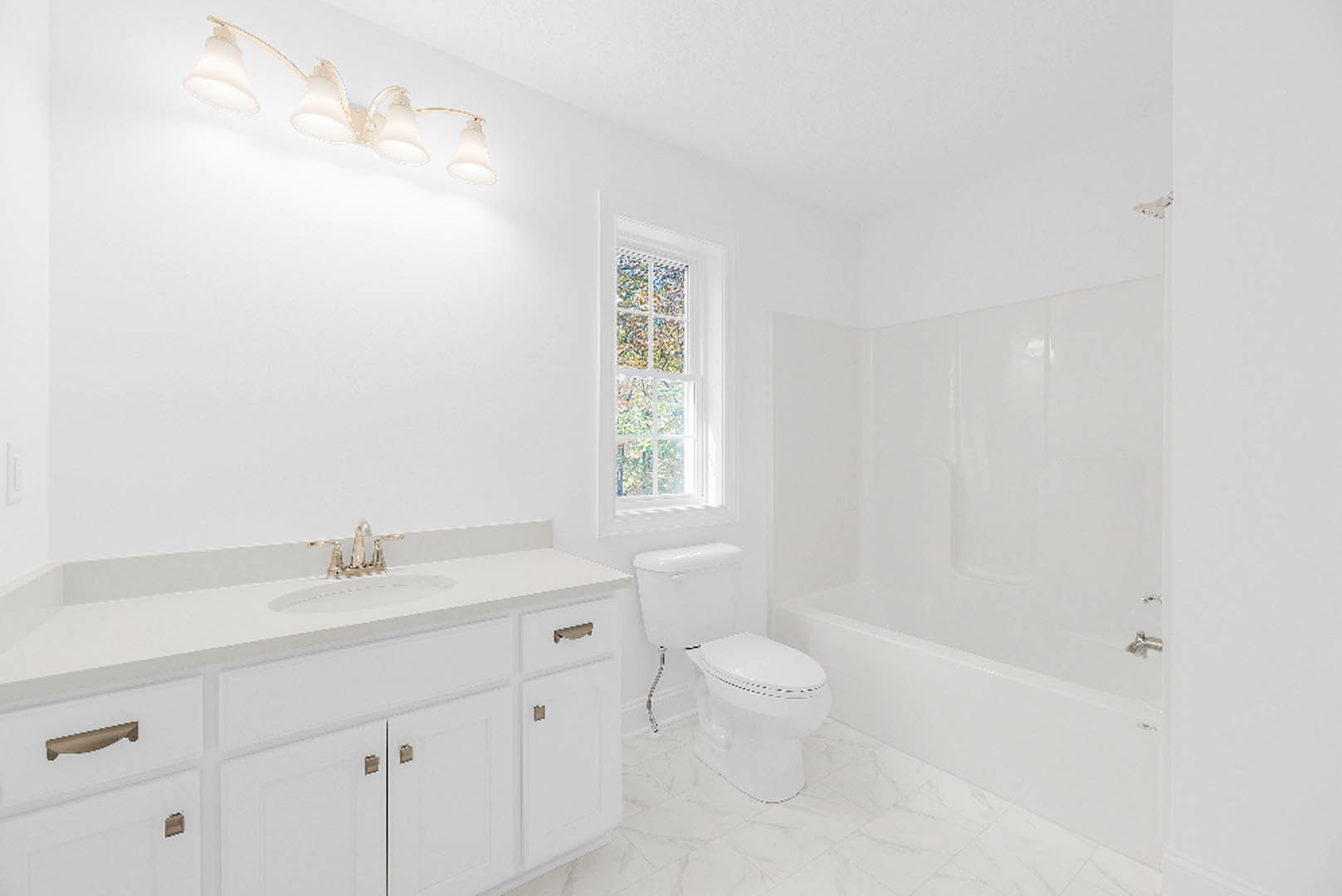 Modern bathroom with white toilet, built-in bathtub, chrome faucet, light fixture, and white-framed window, surrounded by neutral tile walls