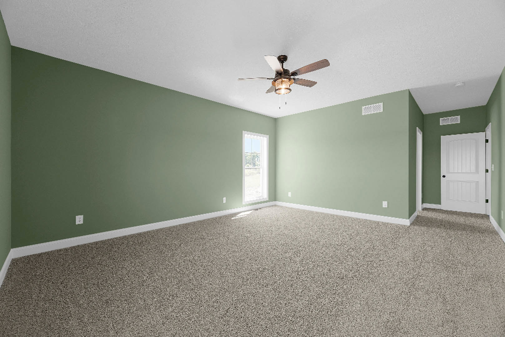 Green-walled room with plush carpet, ceiling fan with light, white door featuring black handle, large window overlooking leafy trees