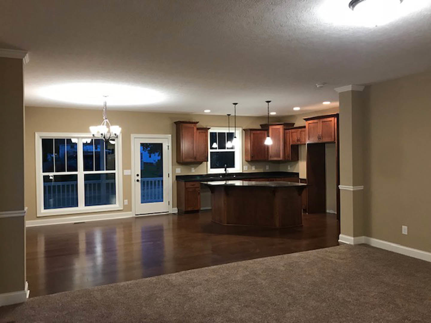 Bar area with dark cabinetry, white countertop, hardwood flooring, recessed lighting, and neutral walls