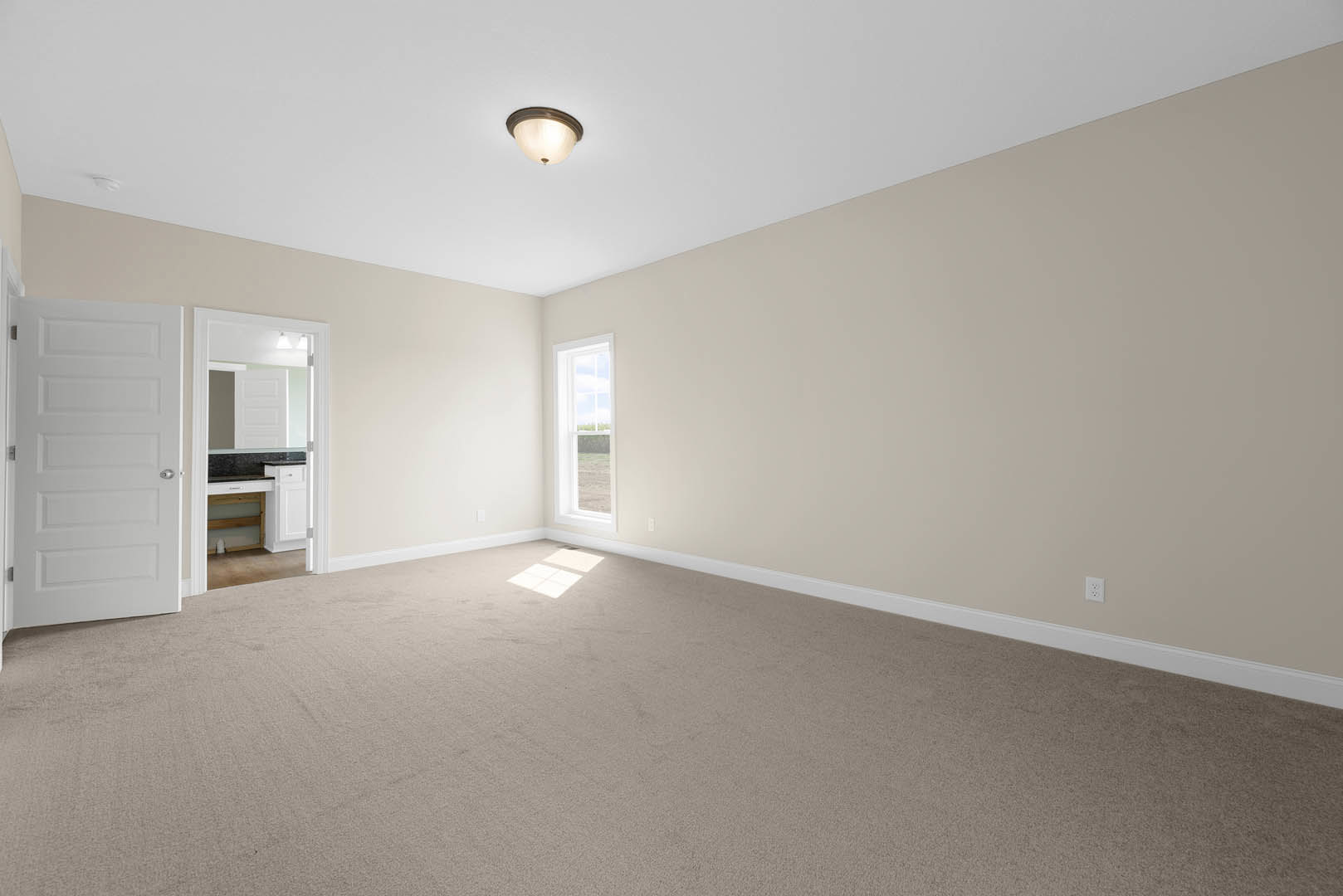 Carpeted room with a ceiling-mounted light fixture, white door with silver knobs, large window letting in natural light, and grey floor with white square tiles